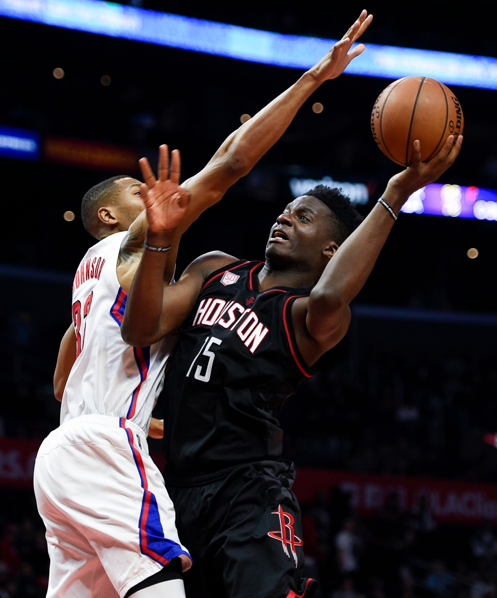 Houston Rockets center Clint Capela, right, attempts a shot defended by Los Angeles Clippers forward Wesley Johnson during the second half of an NBA basketball game in Los Angeles, Wednesday, March 1, 2017. The Rockets won 122-103. (AP Photo/Kelvin Kuo)Clint Capela ROCKETS CLIPPERS BASKETBALL