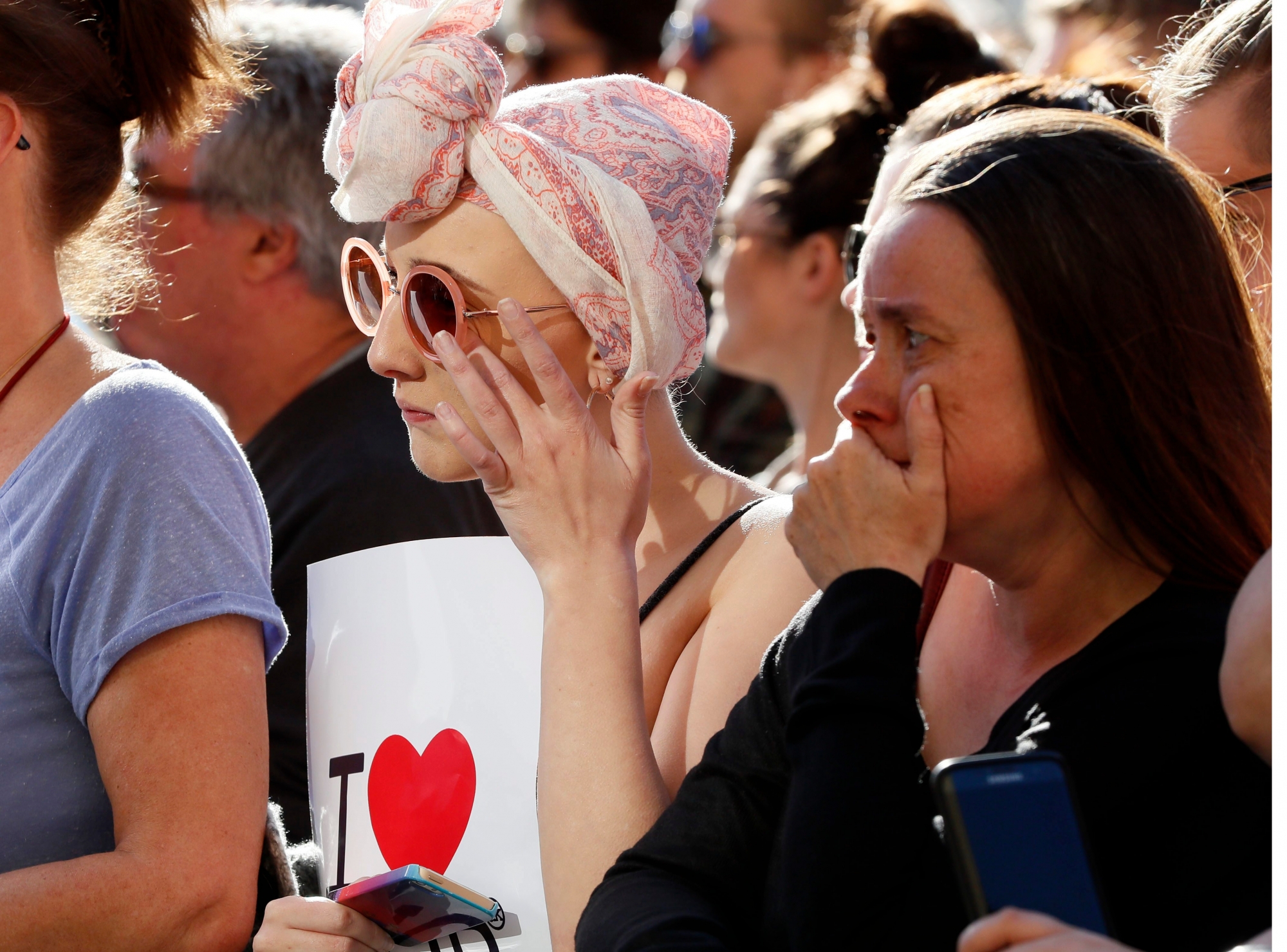 People attend a vigil in Albert Square, Manchester, England, Tuesday May 23, 2017, the day after the suicide attack at an Ariana Grande concert that left 22 people dead as it ended on Monday night. (AP Photo/Kirsty Wigglesworth) Britain Concert Blast