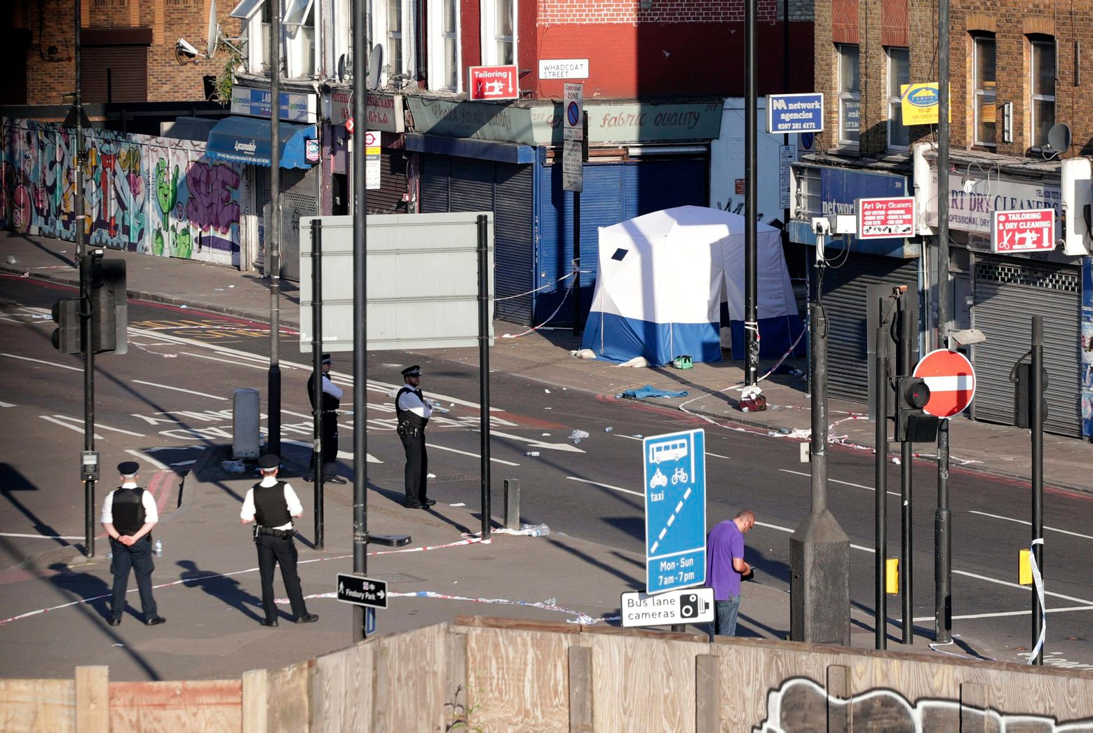 A police forensic tent is erected at Finsbury Park in north London, where a vehicle struck pedestrians Monday, June 19, 2017. A vehicle struck pedestrians near a mosque in north London early Monday morning. (Yui Mok/PA via AP) Britain Pedestrians Struck