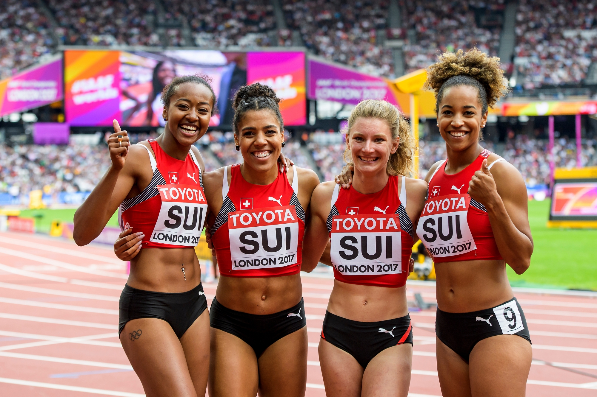 From left to right, Sarah Atcho, Mujinga Kambundji, Ajla Del Ponte, Salome Kora from Switzerland, react during the 4x100m Relay Women Qualification Round at the IAAF World Athletics Championships at the London Stadium, in the Queen Elizabeth Olympic Park in London, Britain, Saturday, August 12, 2017. (KEYSTONE/Jean-Christophe Bott) BRITAIN ATHLETICS WORLD CHAMPIONSHIPS