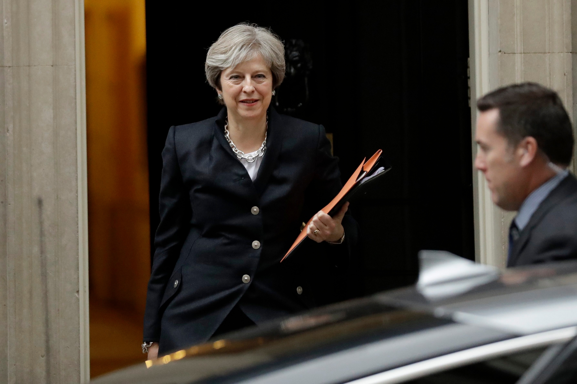 British Prime Minister Theresa May leaves 10 Downing Street to deliver a statement on Brexit to Parliament in London, Monday, Oct. 9, 2017. (AP Photo/Matt Dunham) Britain Politics