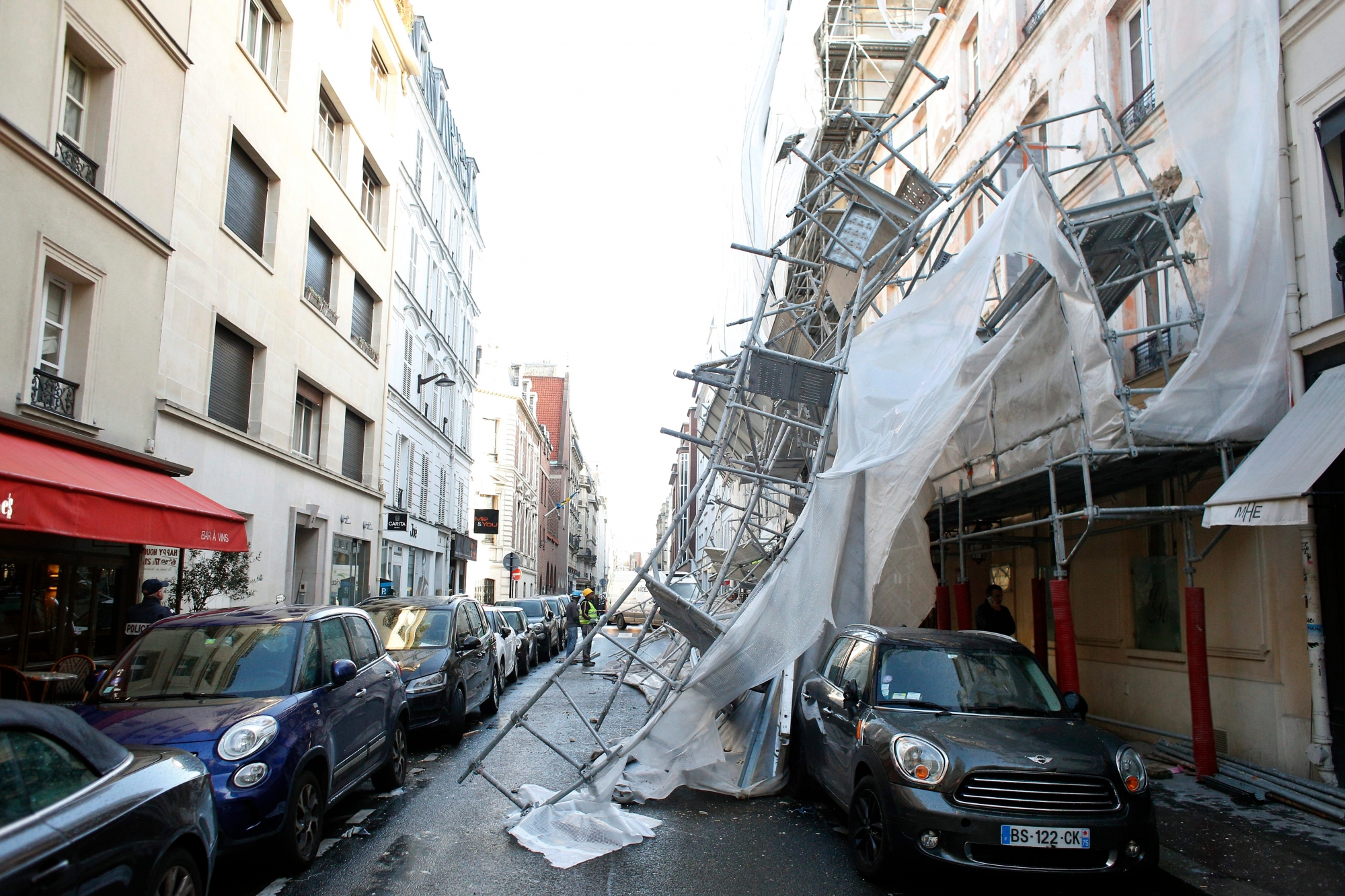 A scaffolding collapsed due to a violent windstorm, in Paris, Wednesday, Jan. 3, 2018, as France's national electricity provider reports 200,000 households without electricity across the country, including 30,000 in the Paris region due to storm damage. A severe storm packing winds of up to 100 miles per hour has battered much of Europe overnight and Wednesday morning, bringing heavy rain, hail and lightning to the region. (AP Photo/Thibault Camus) France Storm