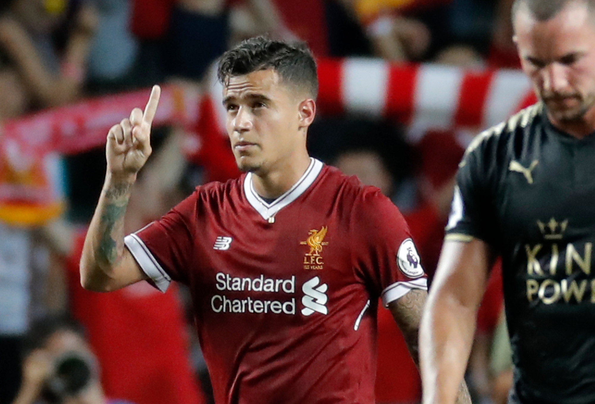 FILE - A Saturday, July 22, 2017, file photo of Liverpool's Philippe Coutinho celebrating after scoring a goal during the final match against Leicester City FC at the Premier League Asia Trophy soccer tournament in Hong Kong. Coutinho is close to sealing a move to Barcelona from Liverpool. A person familiar with the deal tells The Associated Press that Liverpool and Barcelona have reached an agreement that will see the Brazil midfielder move to the Spanish team for a fee of 160 million euros ($192 million). Coutinho was traveling to Spain on Saturday, Jan. 6, 2018 and an announcement was expected on Sunday. (AP Photo/Kin Cheung, File) Soccer Barcelona Coutinho