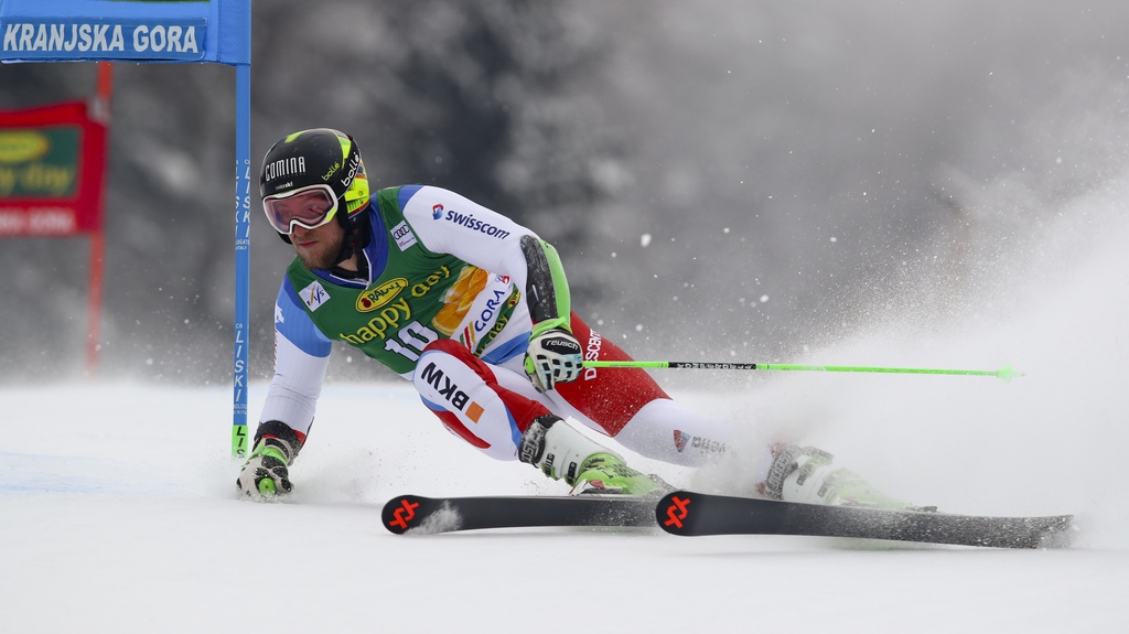 Switzerland's Justin Murisier speeds down the course during an alpine ski, men's World Cup giant slalom in Kranjska Gora, Slovenia, Saturday, March 3, 2018. (AP Photo/Alessandro Trovati)