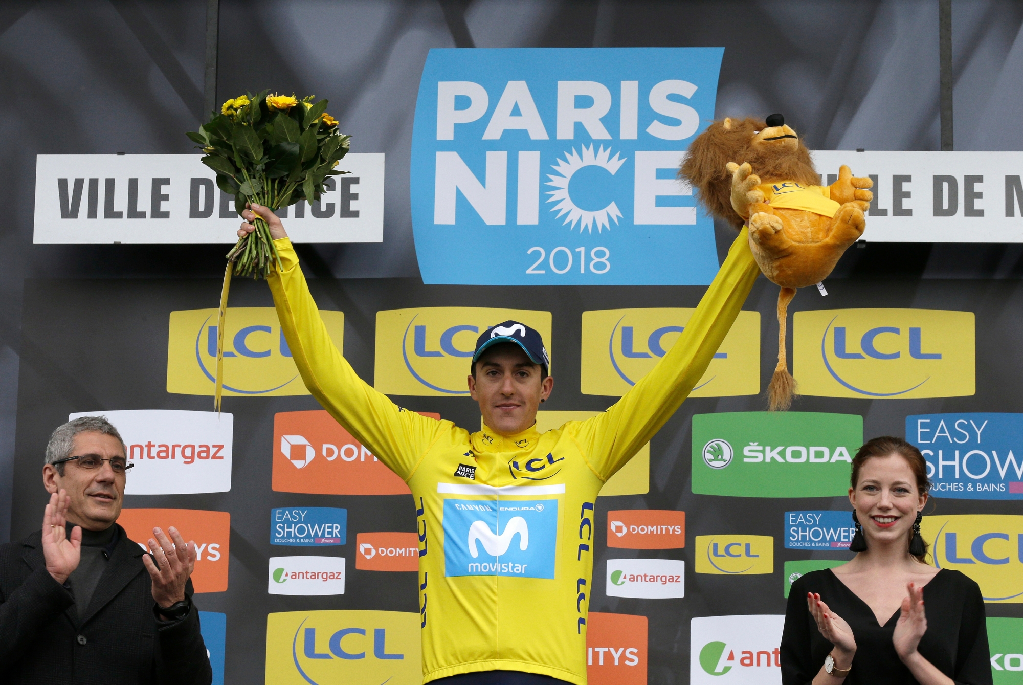 Winner of the Paris-Nice cycling race, Marc Soler of Spain, celebrates on the podium in Nice, southeastern France, Sunday, March 11, 2018. (AP Photo/Claude Paris) France Paris Nice Cycling