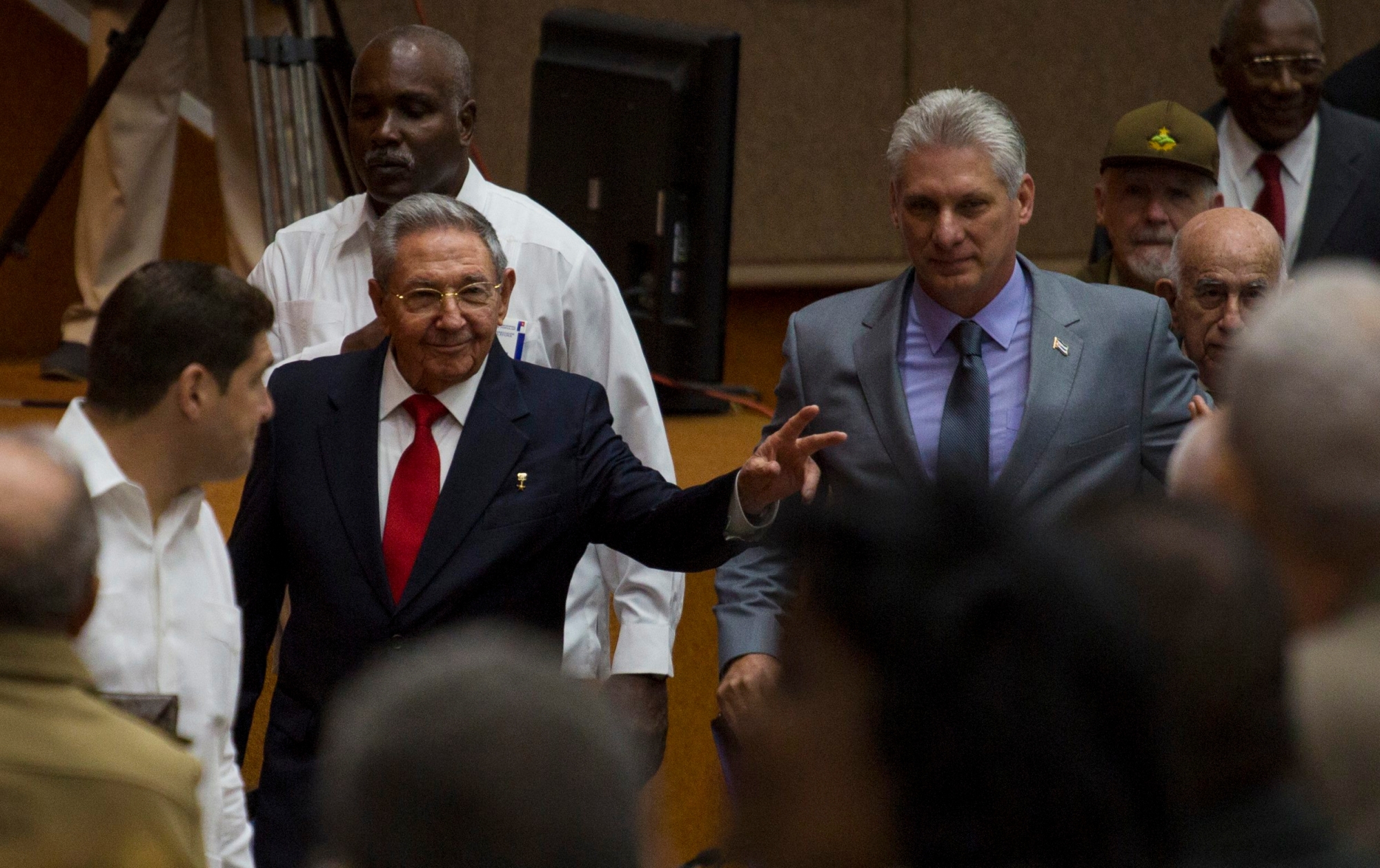 In this photo released by Cuba's state-run media Cubadebate, Cuba's President Raul Castro, center left, enters the National Assembly followed by his successor Miguel Diaz-Canel, center right, for the start of two-day legislative session in Havana, Cuba, Wednesday, April 18, 2018. The Cuban assembly selected the 57-year-old First Vice President as the sole candidate to succeed Castro on Wednesday, in a transition aimed at ensuring that the country's single-party system outlasts the aging revolutionaries who created it. (Irene Perez/Cubadebate via AP) Cuba Transition