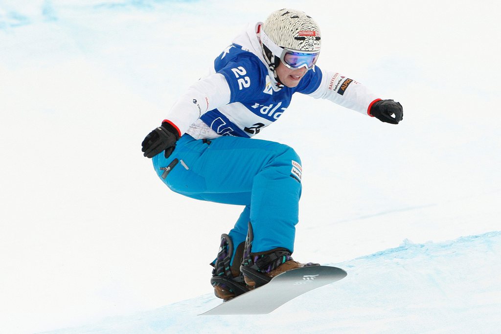 Simona Meiler of Switzerland, jumps during the qualification, at the women's Snowboard Cross World Cup race in Veysonnaz, Switzerland, Thursday, January 14, 2010. (KEYSTONE/Jean-Christophe Bott)