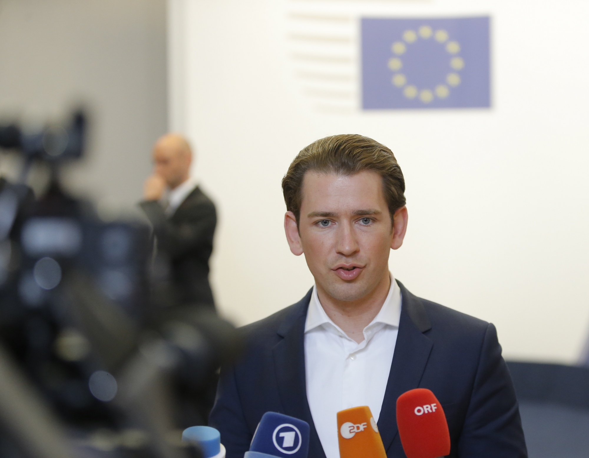 epa06849076 Austria's Chancellor Sebastian Kurz speaks at the end of a night of negotiation on migration during an European Council summit in Brussels, Belgium, 29 June 2018. EU countries' leaders met on 28 and 29 June for a summit to discuss migration in general, the installation of asylum-seeker processing centers in northern Africa, and other security- and economy-related topics including Brexit.  EPA/OLIVIER HOSLET BELGIUM EU COUNCIL SUMMIT