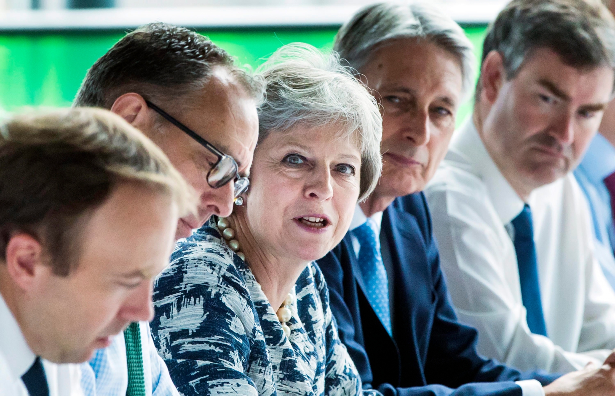 Britain's Prime Minister Theresa May holds a cabinet meeting at Sage Gateshead, England, Monday July 23, 2018, with Secretary of State for Exiting the European Union Dominic Raab, second left, and Chancellor of the Exchequer Philip Hammond, 2nd right.  May has faced a substantial rebellion from party colleagues over Britain's Brexit split from Europe. (Danny Lawson/PA via AP) Britain May Cabinet