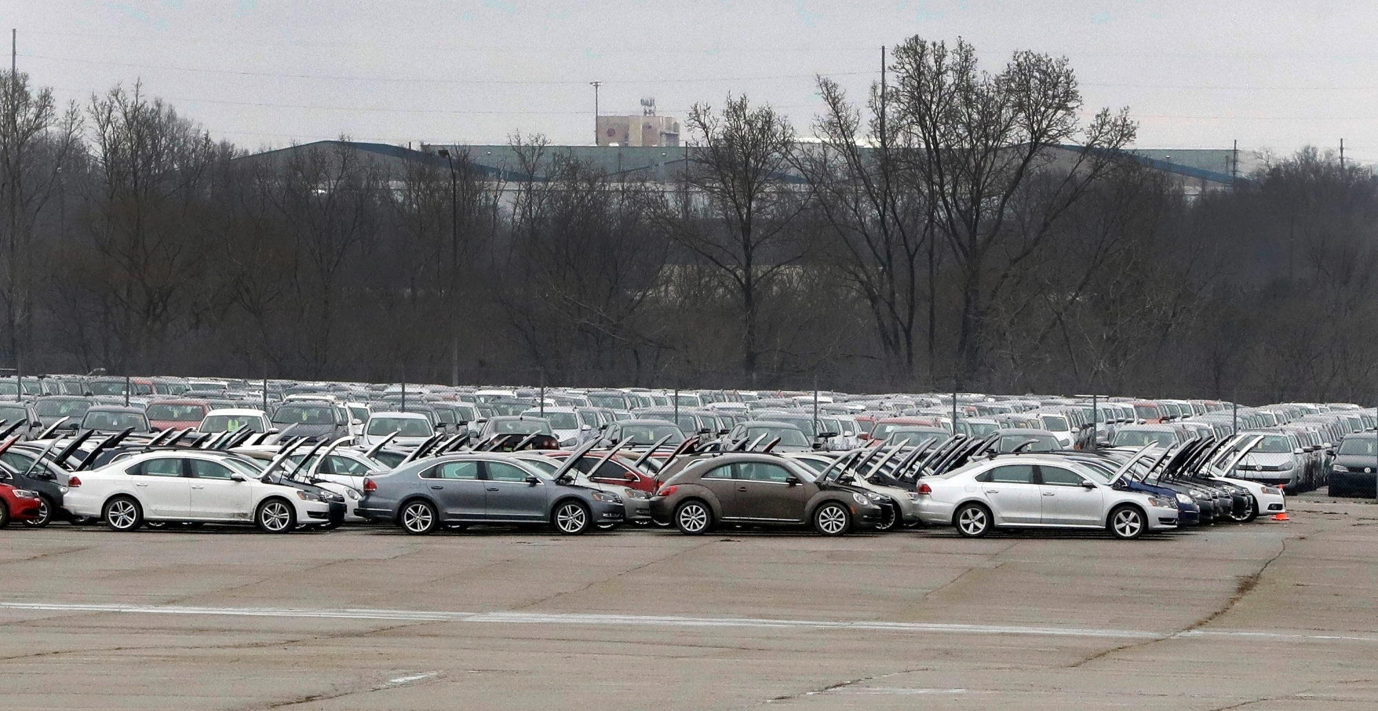 FILE - In this Jan. 24, 2017, file photo, Volkswagen vehicles are stored at the vacant Silverdome in Pontiac, Mich. A U.S. appeals court on Monday, July 9, 2018, approved a $10 billion settlement between Volkswagen and car owners caught up in the company's emissions cheating scandal. (AP Photo/Carlos Osorio, File) VOLKSWAGEN-EMISSIONS SCANDAL