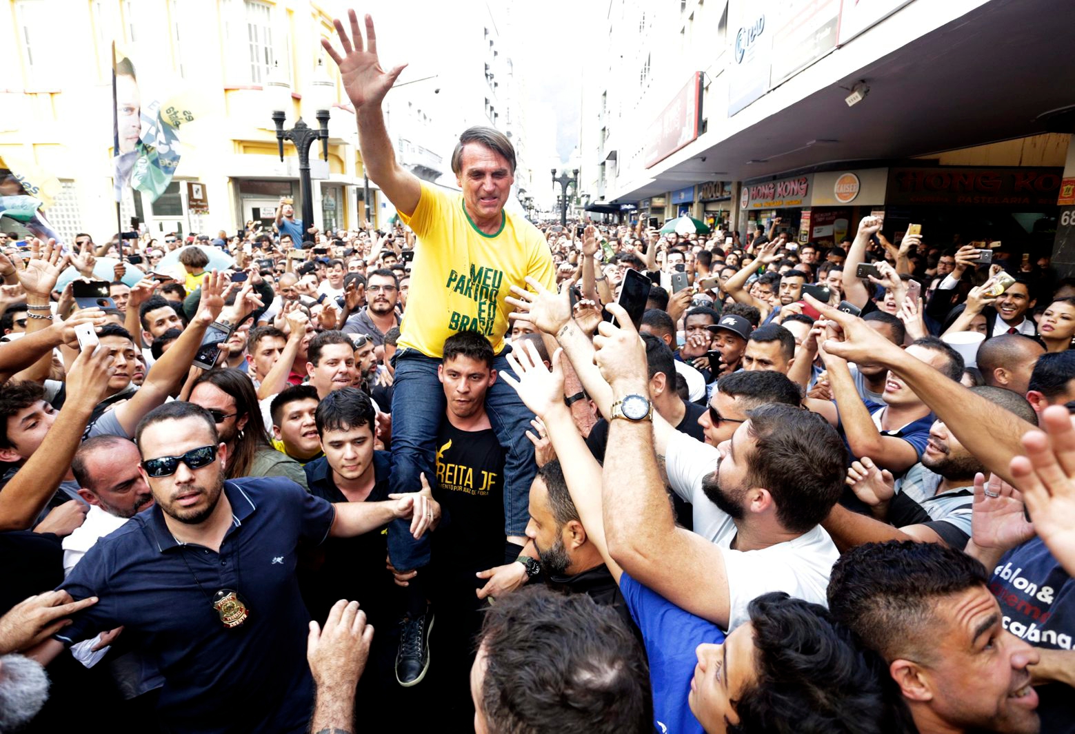 Presidential candidate Jair Bolsonaro is taken on the shoulders of a supporter moments before being stabbed during a campaign rally in Juiz de Fora, Brazil, Thursday, Sept. 6, 2018. Bolsonaro's son said the injury is not life-threatening. (Antonio Scorza/Agencia O Globo via AP) Brazil Candidate Stabbed