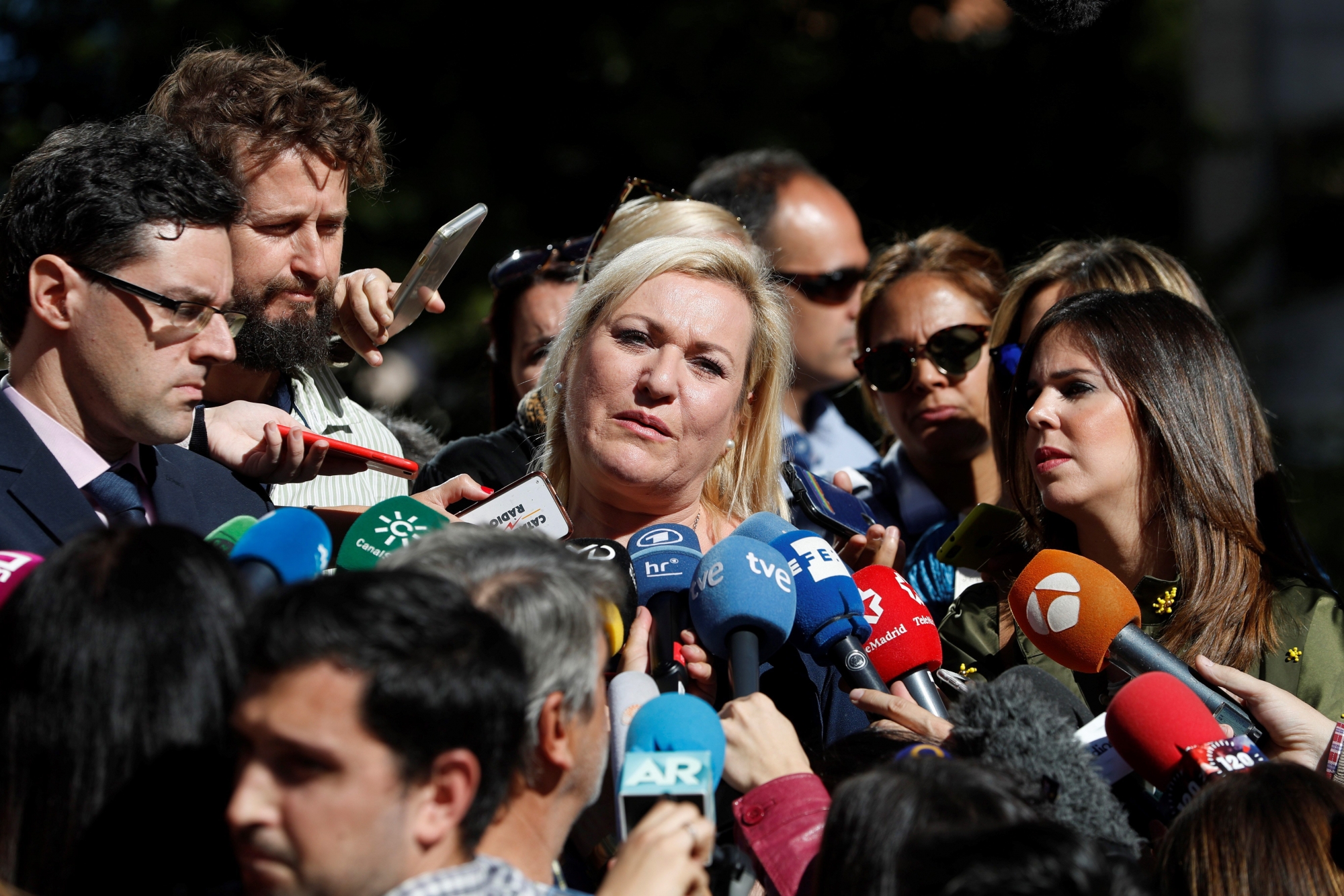 epa07078971 Ines Madrigal (C), snatched from her mother and given away to a sterile woman when she was born in 1969, talks to the media outside of the court in Madrid, Spain, 08 October 2018. Dr. Eduardo Vela was on trial accused of being involved in the stealing of Ines Madrigal when she was born back in 1969. Now, the court has ruled that Ines Madrigal was in fact stolen by Eduardo Vela, currently 85 years old, but he has been cleared as charges exceeded the statue of limitations. This is the first trial against one of the alleged stolen babies cases in Spain. Thousands of babies were allegedly stolen at birth in Spain between 1960 and 1989 by a group of nuns, doctors and other officials who sold the children for profit. The General Attorney was demanding 11 years of imprisonment.  EPA/J.J. GUILLEN SPAIN JUSTICE STOLEN BABIES CASE