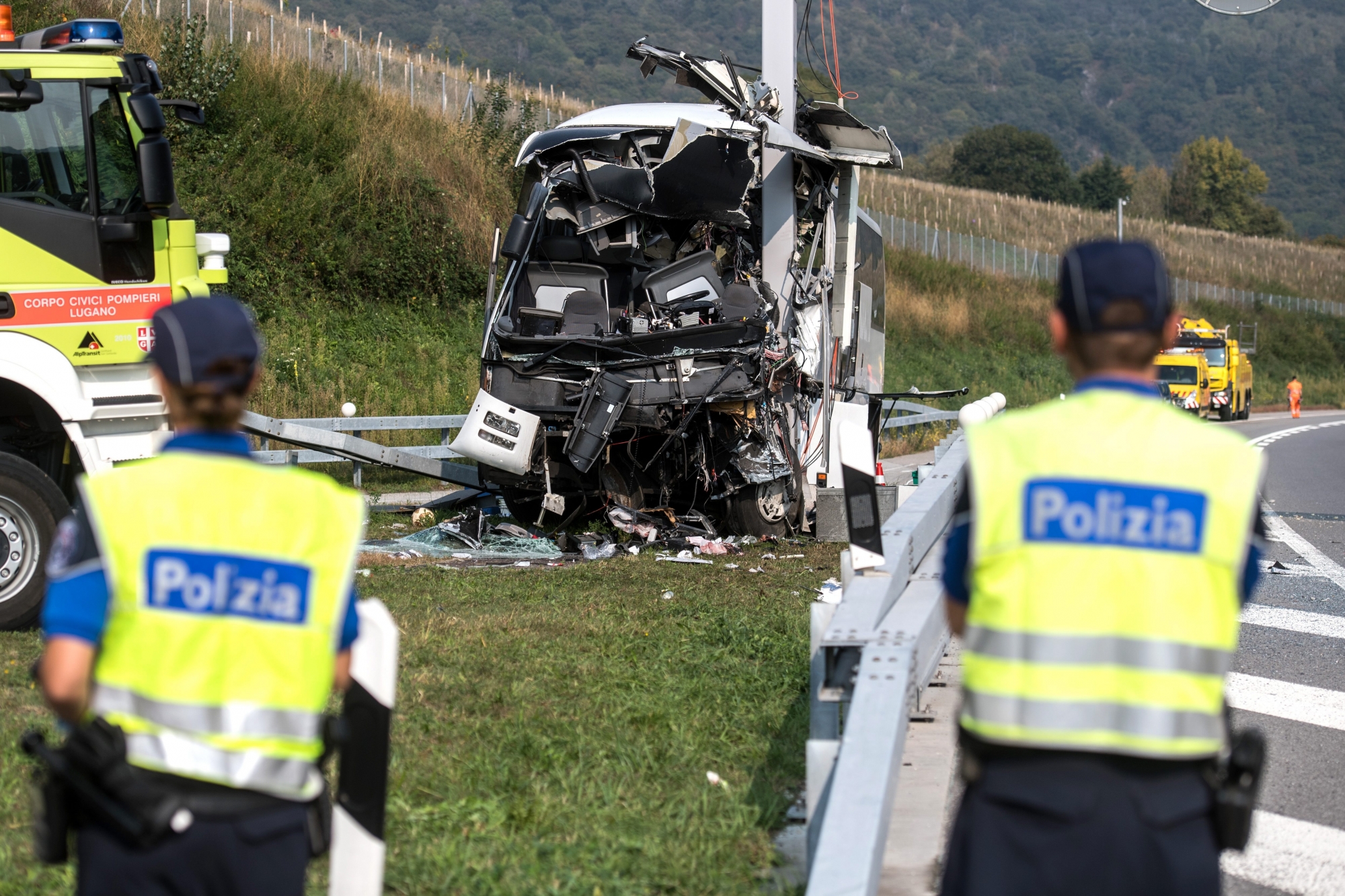 The accident site of a bus registered in Germany that crashed into signal post on the highway A2 in Sigirino, canton of Ticino, Switzerland, on Sunday, October 14, 2018. The A2 highway between Rivera and Lugano-North in is closed to the south. One person died and 13 people were injured in the accident. (KEYSTONE/Ti-Press/Gabriele Putzu) SWITZERLAND ACCIDENT BUS