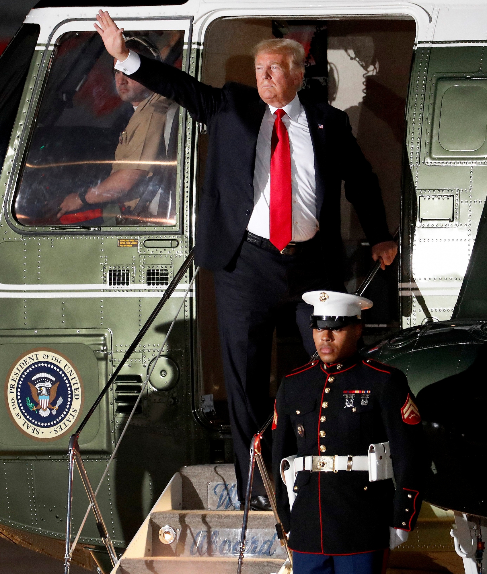 President Donald Trump waves after speaking at a campaign rally Friday, Oct. 19, 2018, in Mesa, Ariz. Trump is in Arizona stumping for Senate candidate Martha McSally. (AP Photo/Matt York) 2018 Election Trump