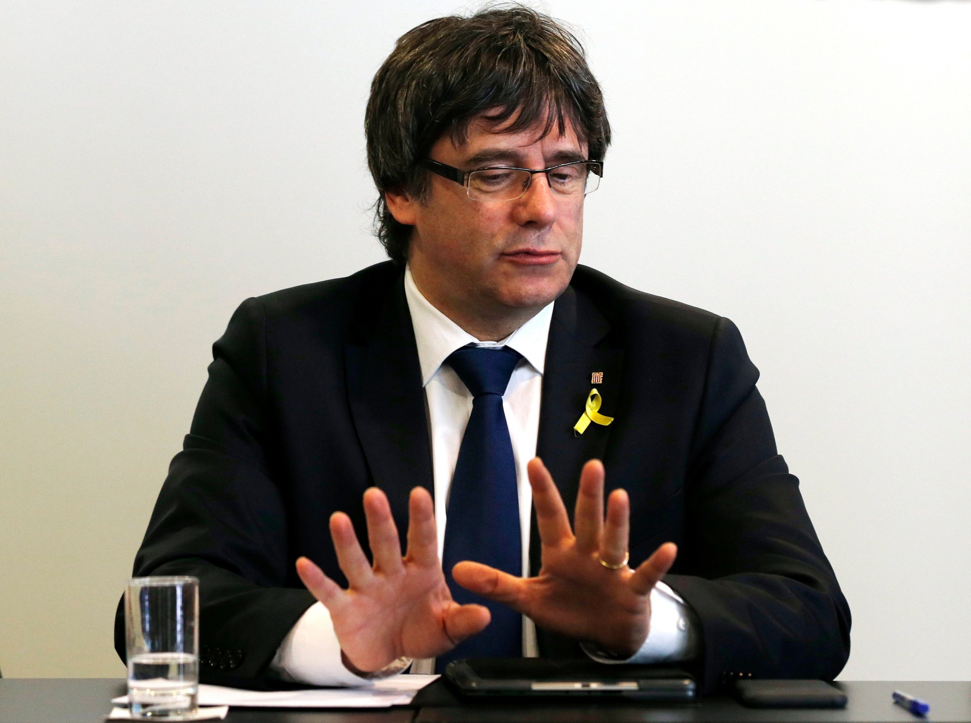 epa06676577 Former Catalan president Carles Puigdemont looks on during a working meeting with members of his parliamentary group, Junts per Catalunya, in Berlin, Germany, 18 April 2018. Puigdemont and the Catalan political platform centered around him discussed further plans on proposing a president for the Catalonian Government and avoid new elections. Puigdemont resides in Berlin because he is still formally in detention and may not leave Germany until German justice decides on his extradition to Spain according to a European arrest warrant.  EPA/FELIPE TRUEBA GERMANY CATALONIA PUIGDEMONT
