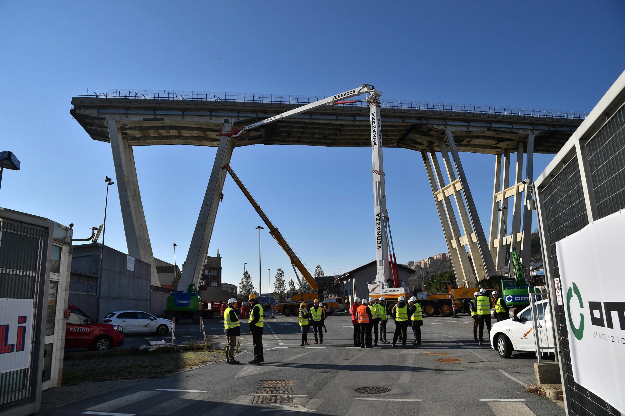 epa07233455 A view of the opening of the construction site for the demolition of the partially collapsed Morandi highway bridge in Genoa, northern Italy, 15 December 2018. The Morandi bridge partially collapsed on 14 August, killing 43 people. According to reports quoting the Italian city's mayor Marco Bucci, Genoa will have a new bridge within a year.  EPA/LUCA ZENNARO ITALY GENOA BRIDGE