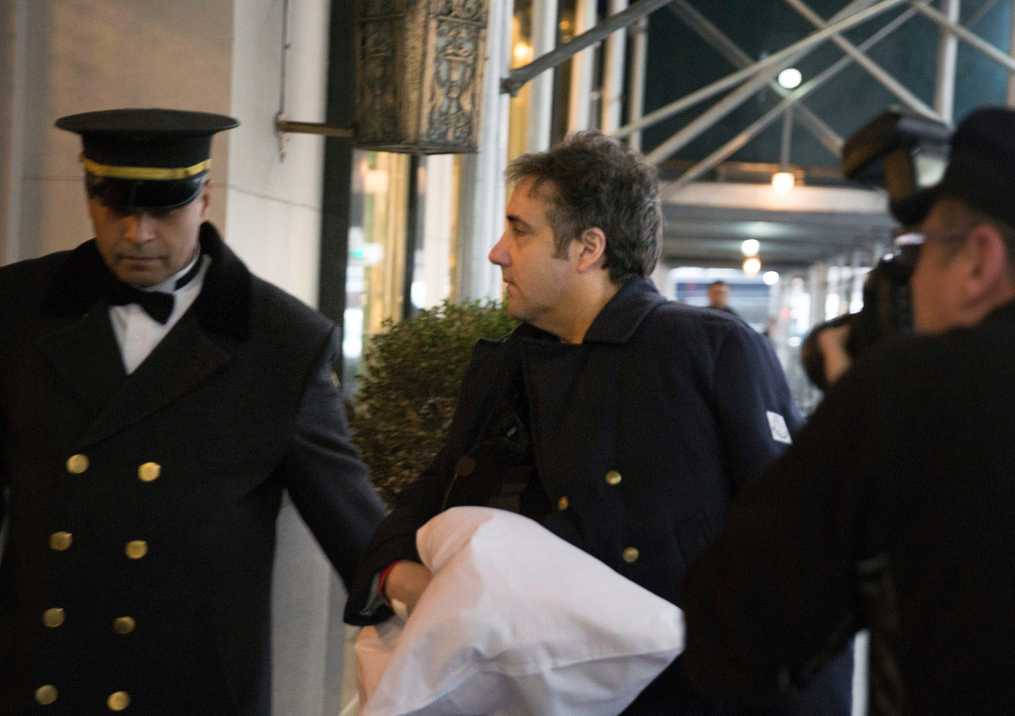 Michael Cohen arrives at his home Thursday, Jan. 18, 2019 in New York.  Democrats are vowing to investigate whether President Donald Trump directed Cohen, his personal attorney, to lie to Congress about a Moscow real estate project, calling that possibility a "concern of the greatest magnitude."  (AP Photo/Kevin Hagen) Trump Russia Probe