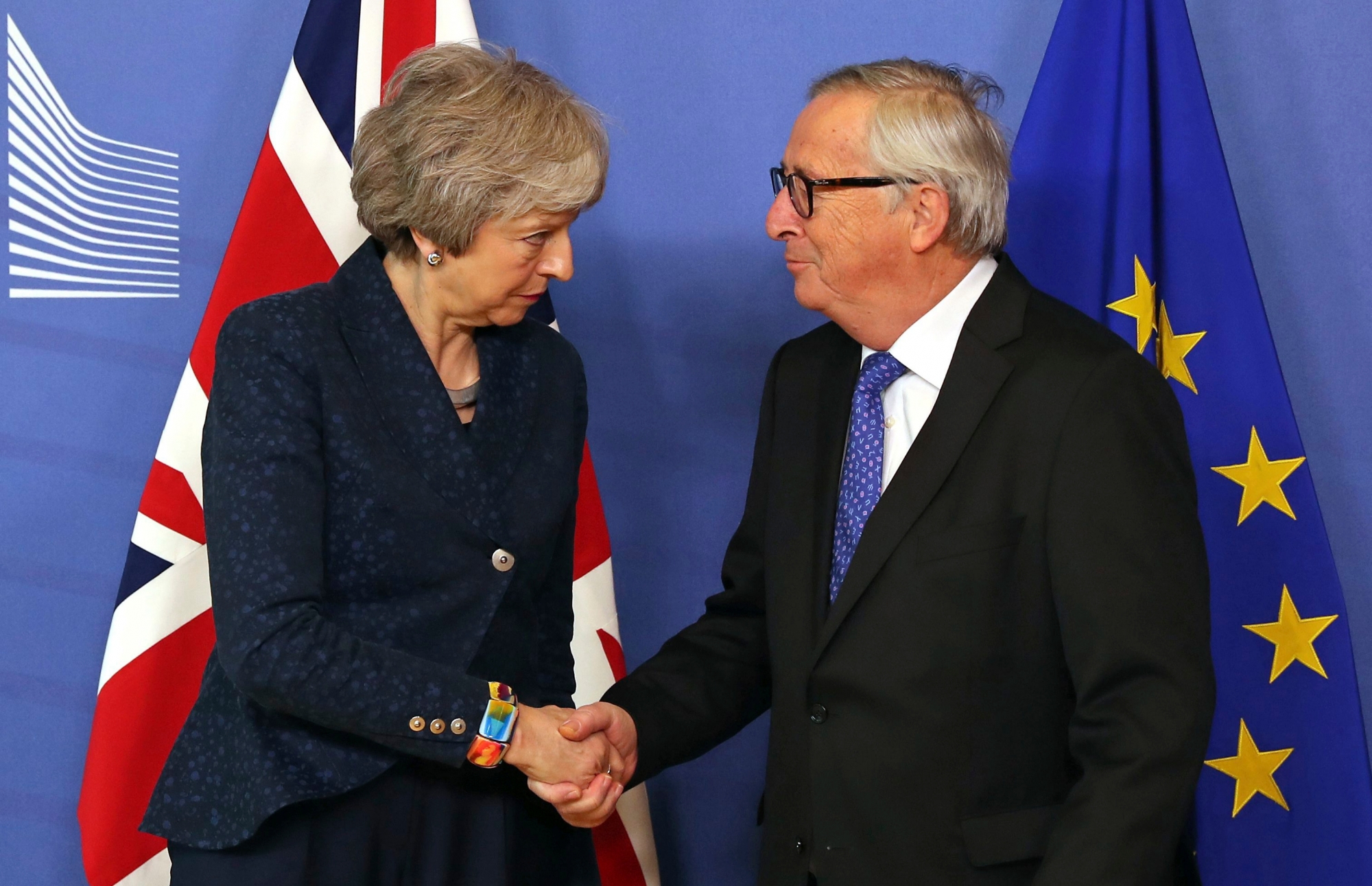 European Commission President Jean-Claude Juncker shakes hands with British Prime Minister Theresa May before their meeting at the European Commission headquarters in Brussels, Thursday, Feb. 7, 2019. (AP Photo/Francisco Seco) Belgium Brexit