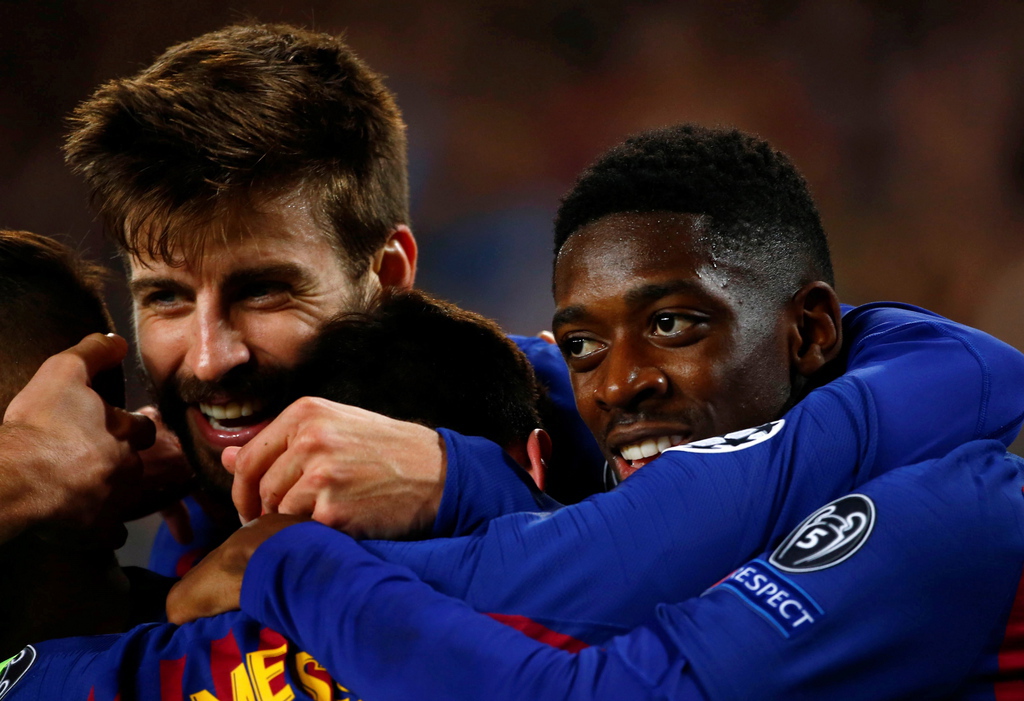epa07435240 FC Barcelona's players Gerard Pique (L) and French Ousmane Dembele (R) celebrate after scoring against Olympique Lyon during the UEFA Champions League round of 16 second leg soccer match between FC Barcelona and Olympique Lyon at Camp Nou in Barcelona, Catalonia, north eastern Spain, 13 March 2019.  EPA/ENRIC FONTCUBERTA