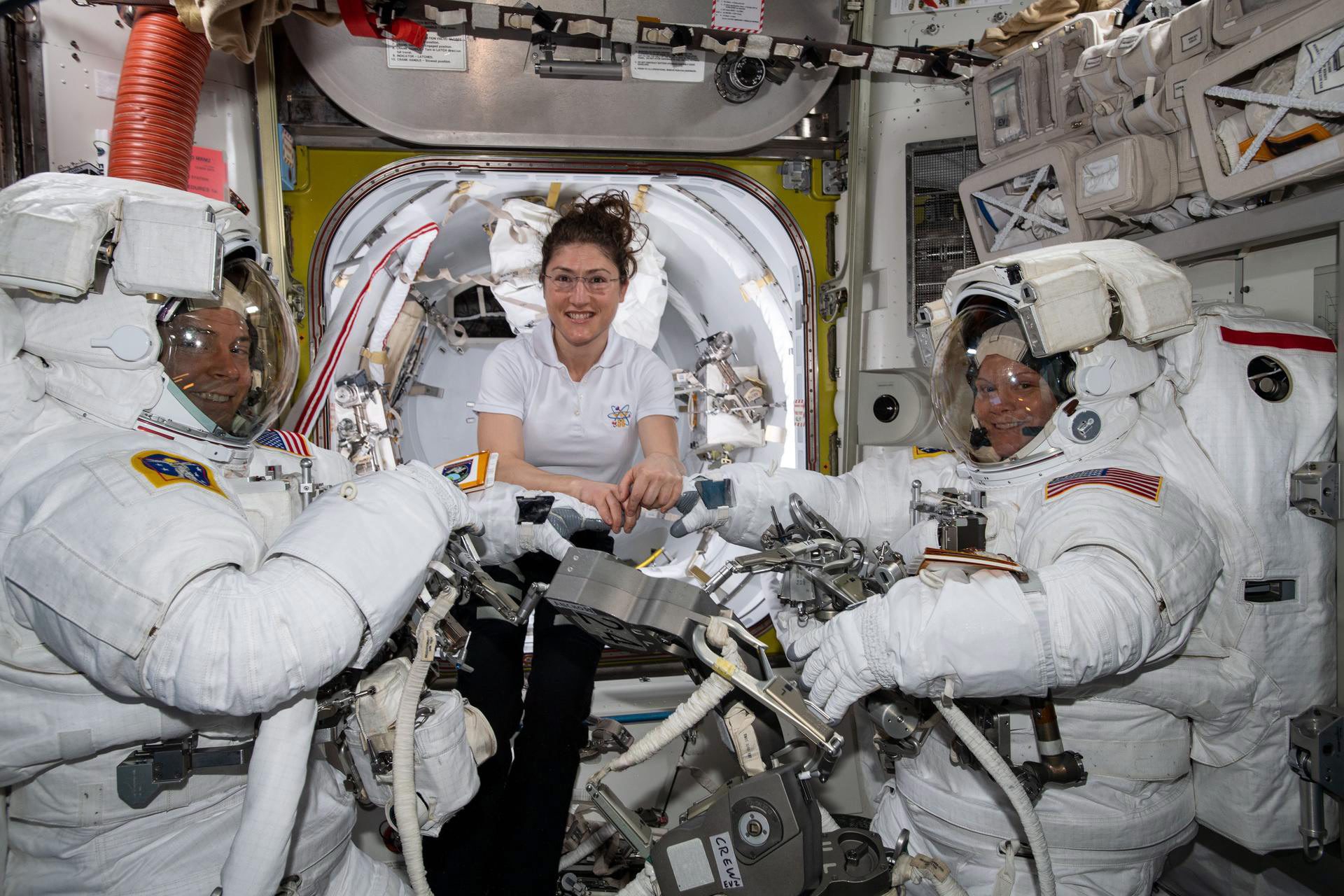 epa07464211 A handout photo made available by the NASA shows NASA astronaut Christina Koch (C) assists fellow astronauts Nick Hague (L) and Anne McClain (R) in their US spacesuits shortly before they begin the first spacewalk of their careers, aboard the International Space Station (ISS), 22 March 2019 (issued 26 March 2019). The NASA on 26 March 2019 said it has cancelled the first all-female spacewalk which was scheduled for 29 March 2019, citing spacesuit issues.  EPA/NASA / HANDOUT  HANDOUT EDITORIAL USE ONLY/NO SALES SPACE ISS SPACEWALK CANCELLED