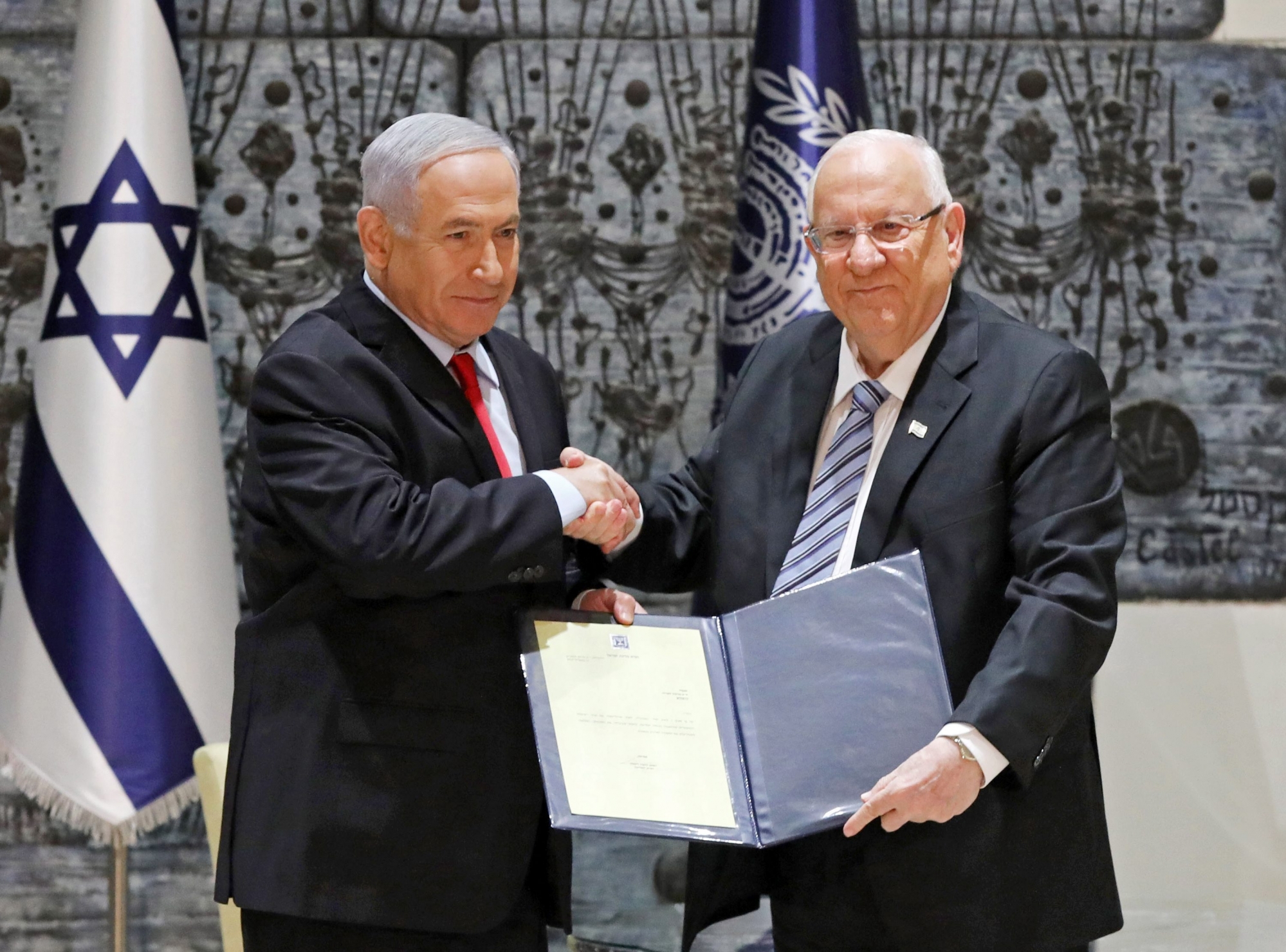 epa07512646 Israeli President Reuven Rivlin (R) hands a letter of appointment for entrusted with forming the next government to Israeli Prime Minister and Chairman of the Likud Party Benjamin Netanyahu (L) at the President's residence in Jerusalem, Israel, 17 April 2019. Benjamin Netanyahu won the 09 April elections and will soon form his government. Netanyahu will enter his fifth term as Prime Minister of Israel.  EPA/ABIR SULTAN ISRAEL PARLIAMENT ELECTIONS