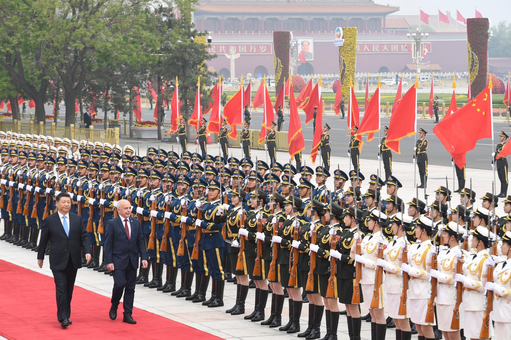 epa07535655 Switzerland's President Ueli Maurer (front, 2-L) and China's President Xi Jinping (front, L) review honor guards during a welcome ceremony at the Great Hall of the People in Beijing, China, 29 April 2019.  EPA/MADOKA IKEGAMI / POOL CHINA SWITZERLAND DIPLOMACY