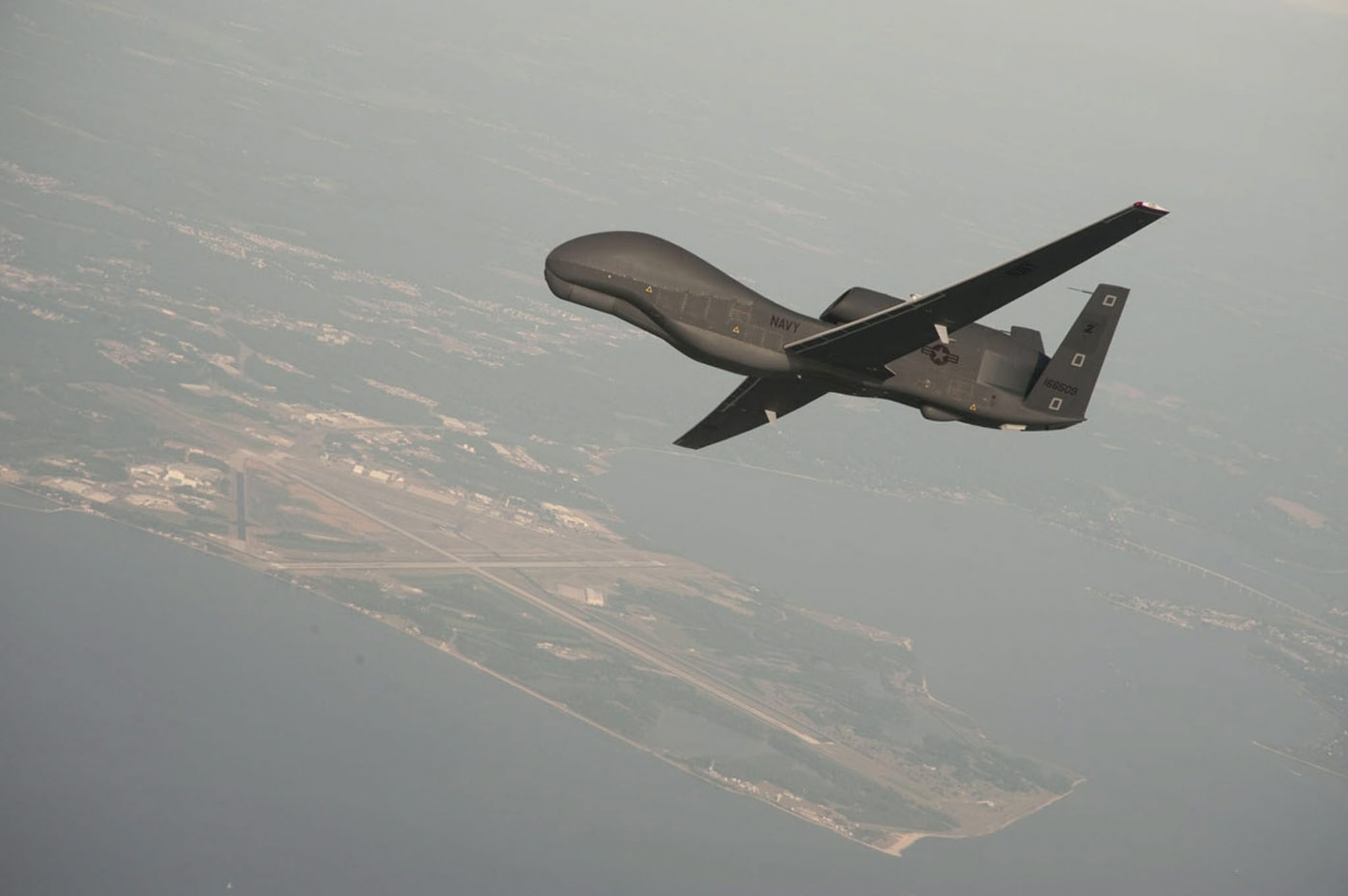 epa07659405 A handout photo made available by the US Navy provided by Northrop Grumman, a RQ-4 Global Hawk  unmanned aerial vehicle conducts tests over Naval Air Station Patuxent River, Maryland, USA 25 June 2010. Media reports on 20 June 2019 state that Iran's Islamic Revolution Guards Corps (IRGC) claim to have shot down a US spy drone over Iranian airspace, near Kuhmobarak in Iran's southern Hormozgan province. The US military has not confirmed if a drone was hit.  EPA/Erik Hildebrandt / US NAVY/  HAN  HANDOUT EDITORIAL USE ONLY/NO SALES USA IRAN DRONE SHOOTING