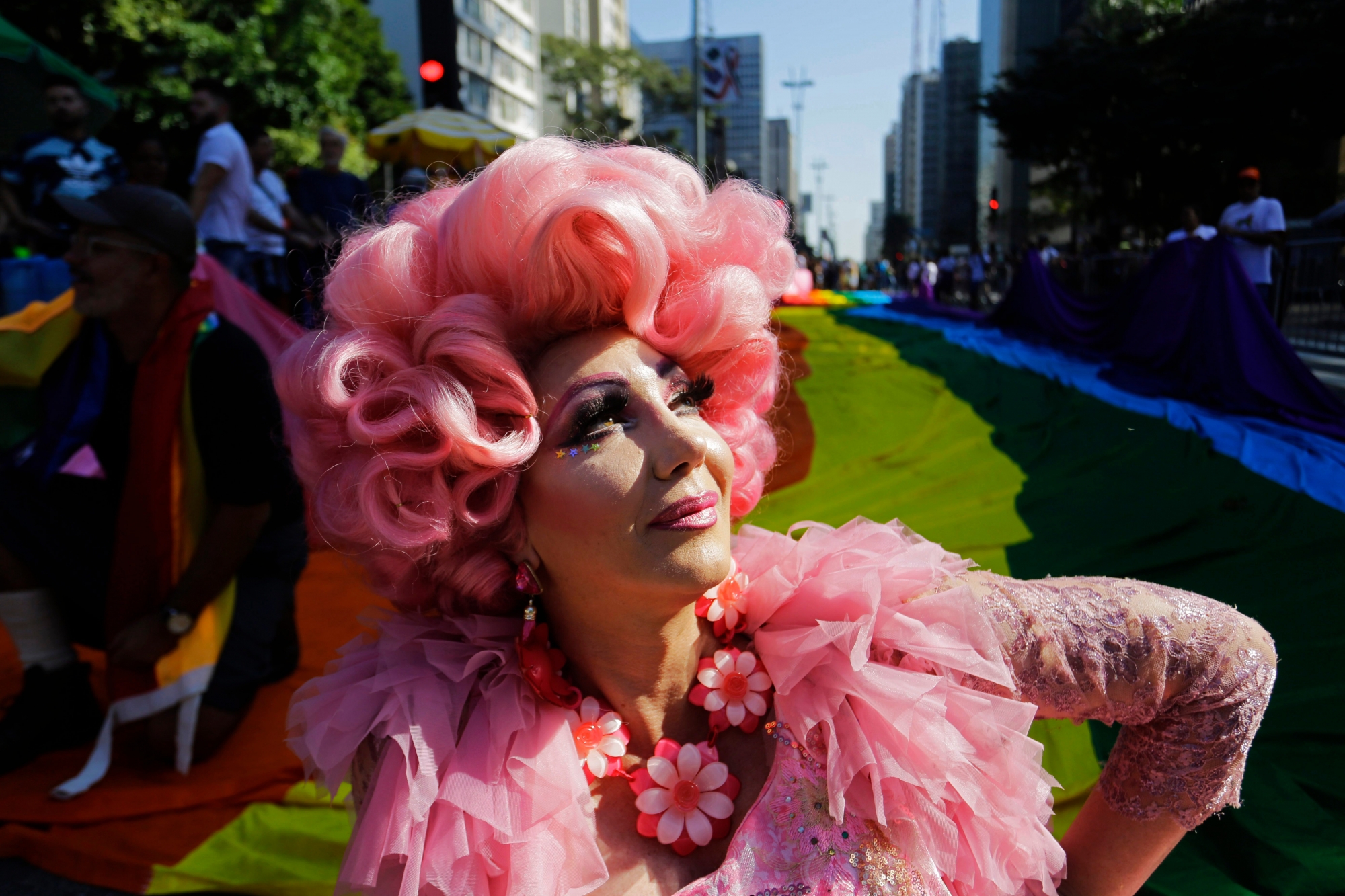 A reveler poses for a picture during the annual gay pride parade along Paulista avenue in Sao Paulo, Brazil, Sunday, June 23, 2019. (AP Photo/Nelson Antoine) APTOPIX Brazil Gay Pride Parade