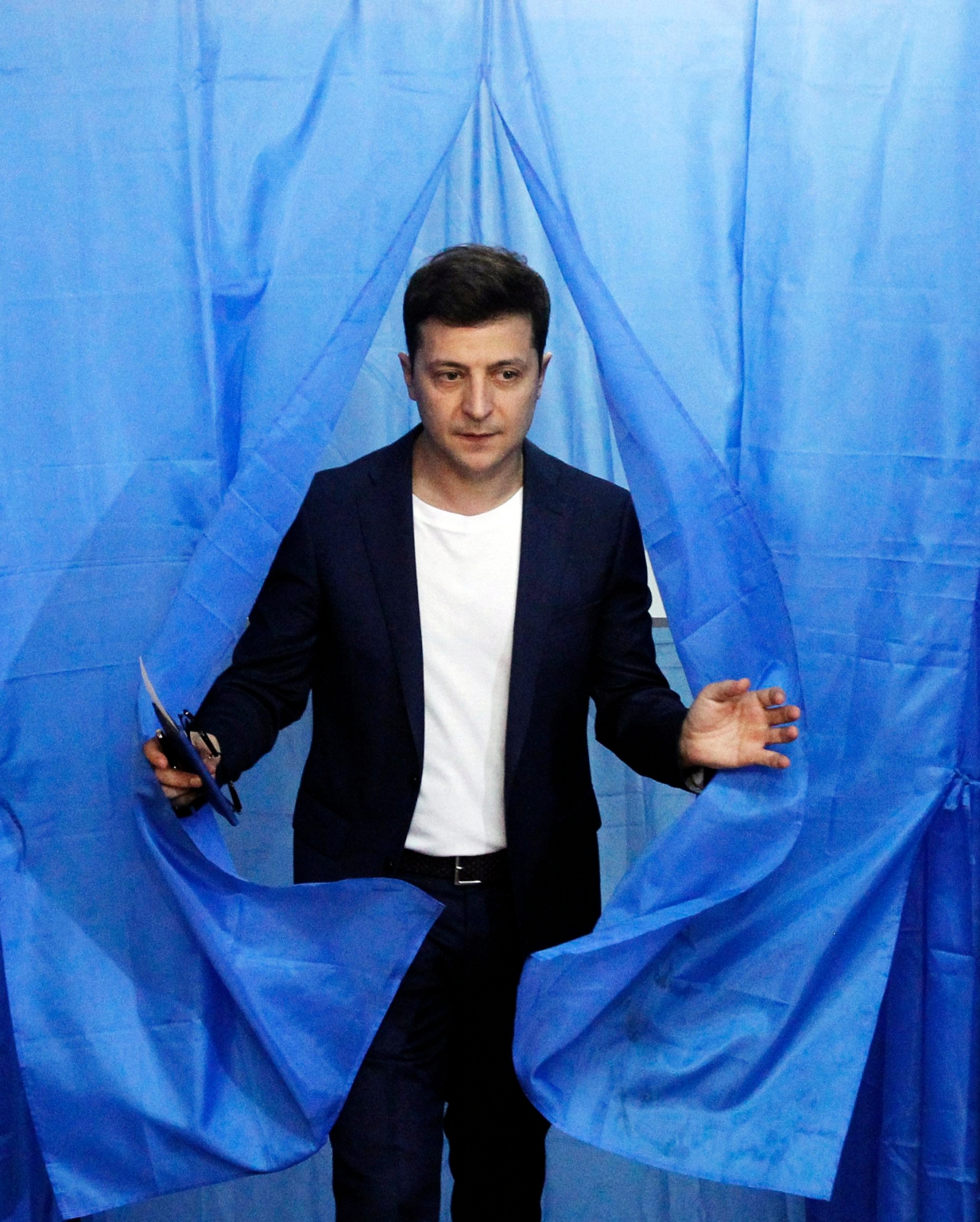 epa07519107 Ukrainian Presidential candidate Volodymyr Zelensky walks out of a voting booth at a polling station during Presidential elections in Kiev, Ukraine, 21 April 2019. Ukrainians vote in the second round of Presidential elections on 21 April 2019. After the first round of elections, showman Volodymyr Zelensky is a frontrunner with 30.24 percent of votes and incumbent president Petro Poroshenko is a runner-up with 15.95 percent of votes.  EPA/STEPAN FRANKO UKRAINE PRESIDENT ELECTIONS