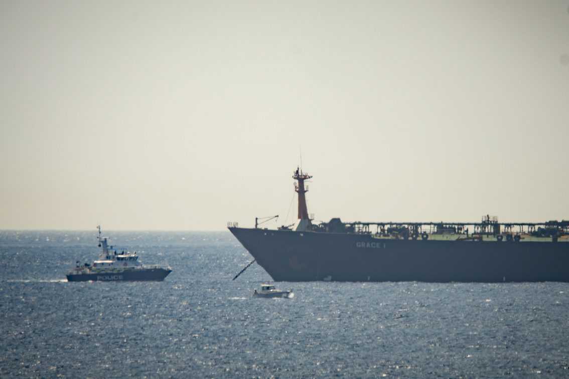 A view of the Grace 1 super tanker near a Royal Marine patrol vessel in the British territory of Gibraltar, Thursday, July 4, 2019. Spain's acting foreign minister says a tanker stopped off Gibraltar and suspected of taking oil to Syria was intercepted by British authorities after a request from the United States. (AP Photo/Marcos Moreno) Gibraltar Persian Gulf Tension