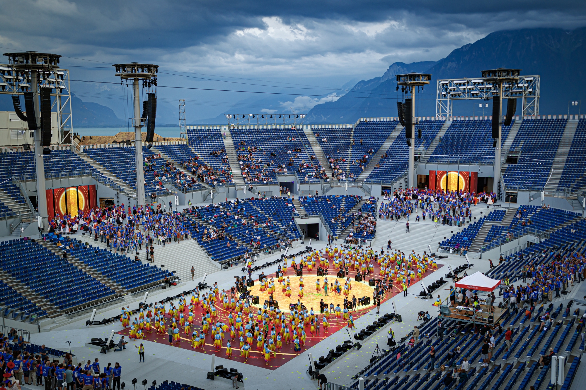 Extras are pictured in the arena of the "Fete des Vignerons" (winegrowers' festival in French), with a capacity of 20'000 spectators and hosting a giant central LED floor of approximately 800 square meters, during a rehearsal in Vevey, Switzerland, Thursday, May 20, 2019. Organized in Vevey by the brotherhood of winegrowers since 1979, the event will celebrate winemaking from July 18 to August 11 this year. (KEYSTONE/Valentin Flauraud)..Des figurants sont photographies dans l'arene de la Fete des Vignerons (FEVI) et son sol en LED geant d'approximativement 800 metres carres pendant une repetition ce jeudi 20 juin 2019 a Vevey.  (KEYSTONE/Valentin Flauraud) SWITZERLAND FETE DES VIGNERONS REHEARSAL