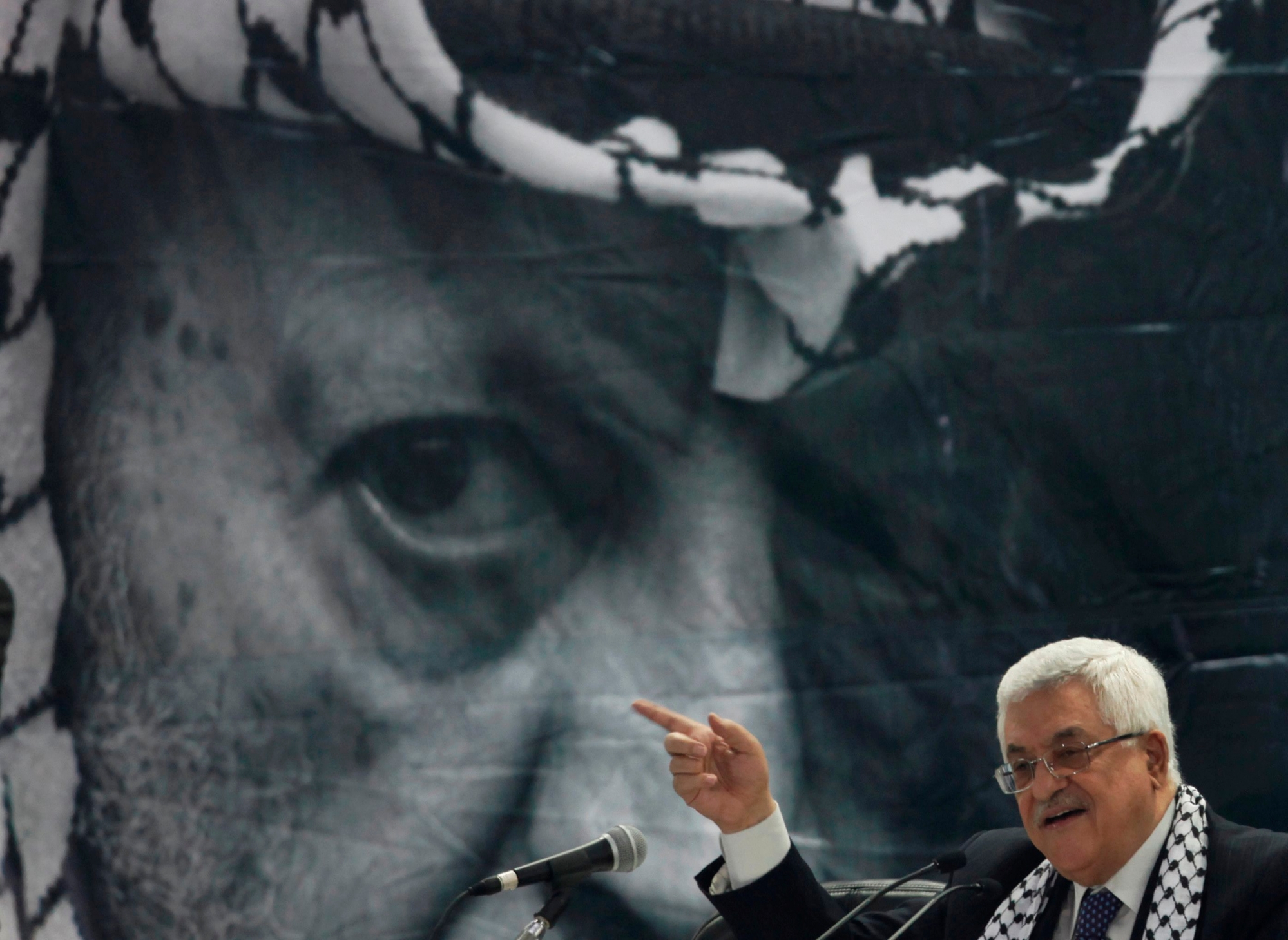 FILE - In this Aug. 4, 2009 file photo, Palestinian President Mahmoud Abbas speaks at the Fatah conference with a portrait of late Palestinian leader Yasser Arafat in the background, in the West Bank town of Bethlehem. With paths to Palestinian statehood blocked, President Mahmoud Abbas is warning heís fast-tracking his retirement and hinting he will announce dramatic policy changes at the United Nations General Assembly on Sept. 30, 2015 including a more-confrontational relationship with Israelís right-wing government. (AP Photo/Tara Todras-Whitehill, File) Mideast Palestinians Abbas Future