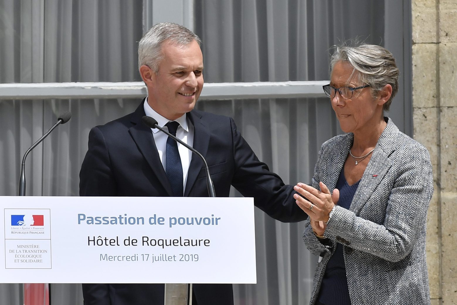 epa07722466 Former Environment Minister Francois de Rugy (L) speaks next to the newly-appointed French Environment Minister Elisabeth Borne (R) during a handover ceremony in Paris, France, 17 July 2019. Francois de Rugy presented his resignation to the French Prime Minister on 16 July 2019, following a controversy about the alleged misuse of public funds. According to French news website Mediapart on 10 July 2019, the then-President of the French National Assembly Francois de Rugy organized several sumptuous private dinners with public funds at the Hotel de Lassay, residence of the President of the French National Assembly. De Rugy claimed during a press conference that they were working dinners.  EPA/JULIEN DE ROSA FRANCE GOVERNMENT ENVIRONMENT MINISTER