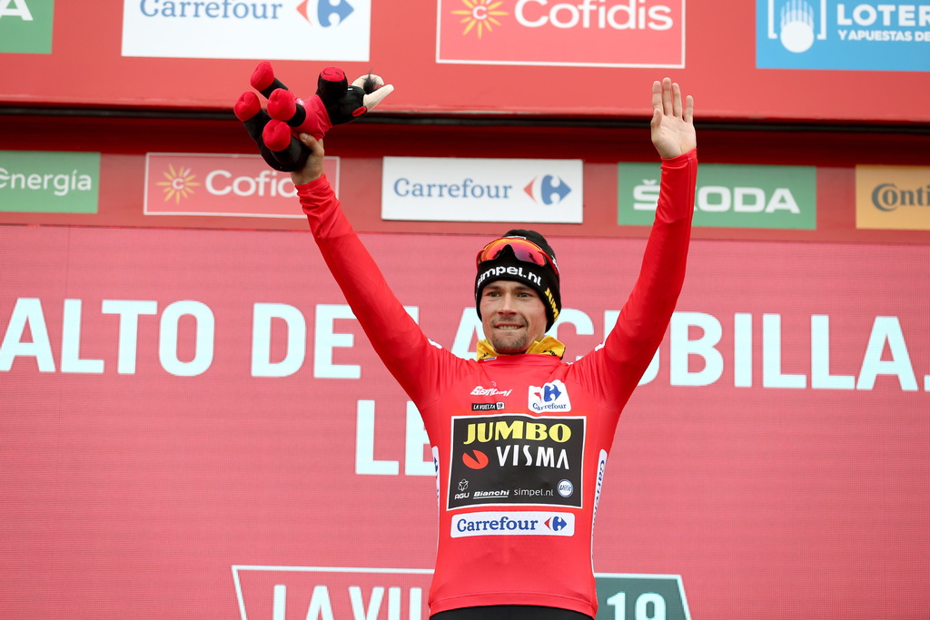 epa07830551 Slovenian rider Primoz Roglic of Jumbo-Visma team celebrates on the podium retaining the overall leader's red jersey following the 16th stage of the Vuelta a Espana cycling tour, over 144.4km from Pravia to Lena, in northern Spain, 09 September 2019. EPA/JAVIER LIZON
