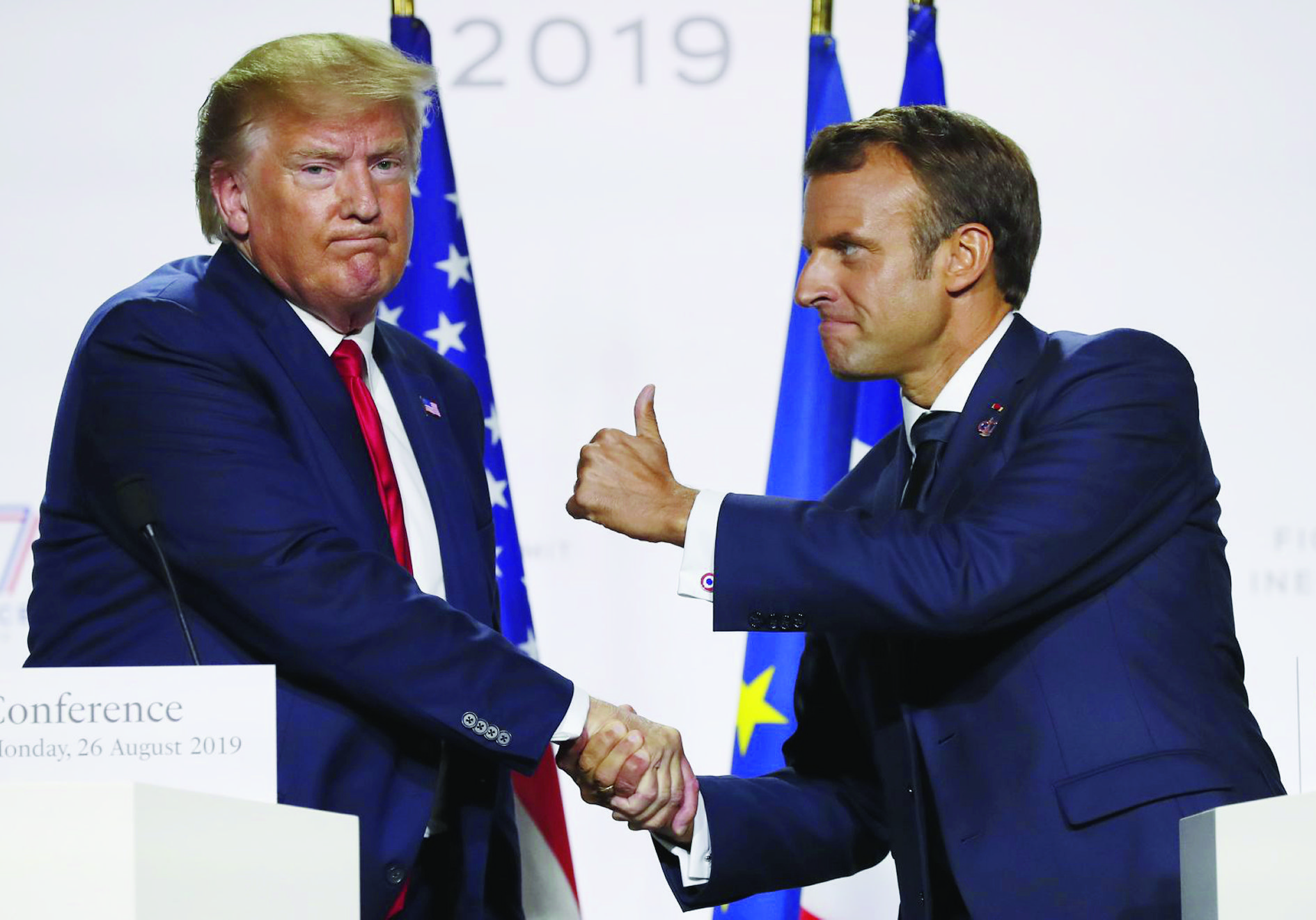 French President Emmanuel Macron and U.S President Donald Trump shake hands during the final press conference during the G7 summit Monday, Aug. 26, 2019 in Biarritz, southwestern France. French president says he hopes for meeting between US President Trump and Iranian President Rouhani in coming weeks. (AP Photo/Francois Mori) APTOPIX France G7 Summit