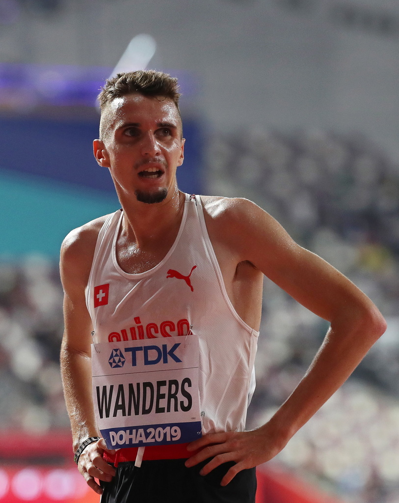 epa07874663 Julien Wanders of Switzerland reacts after competing in the men's 5,000m heats at the IAAF World Athletics Championships 2019 at the Khalifa Stadium in Doha, Qatar, 27 September 2019. EPA/SRDJAN SUKI