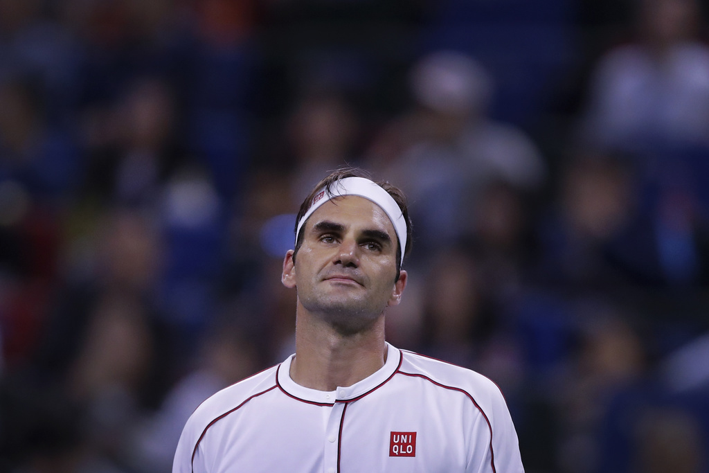 Roger Federer of Switzerland reacts during the men's singles match against David Goffin of Belgium at the Shanghai Masters tennis tournament at Qizhong Forest Sports City Tennis Center in Shanghai, China, Thursday, Oct. 10, 2019. (AP Photo/Andy Wong).Roger Federer