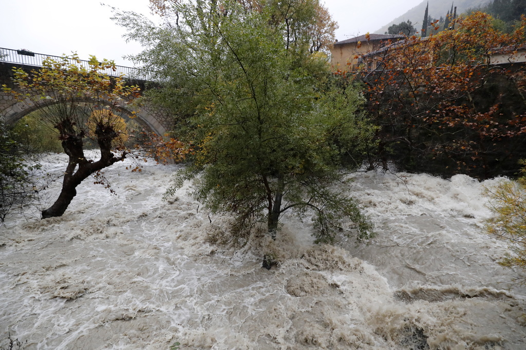 epa08019803 General view of a flooded river due to heavy rainfalls in Pont-du-loup, near Grasse, southern Paris, France, 23 November 2019. Eleven districts in southern France have been put on alert for storms, high winds and flooding. EPA/SEBASTIEN NOGIER