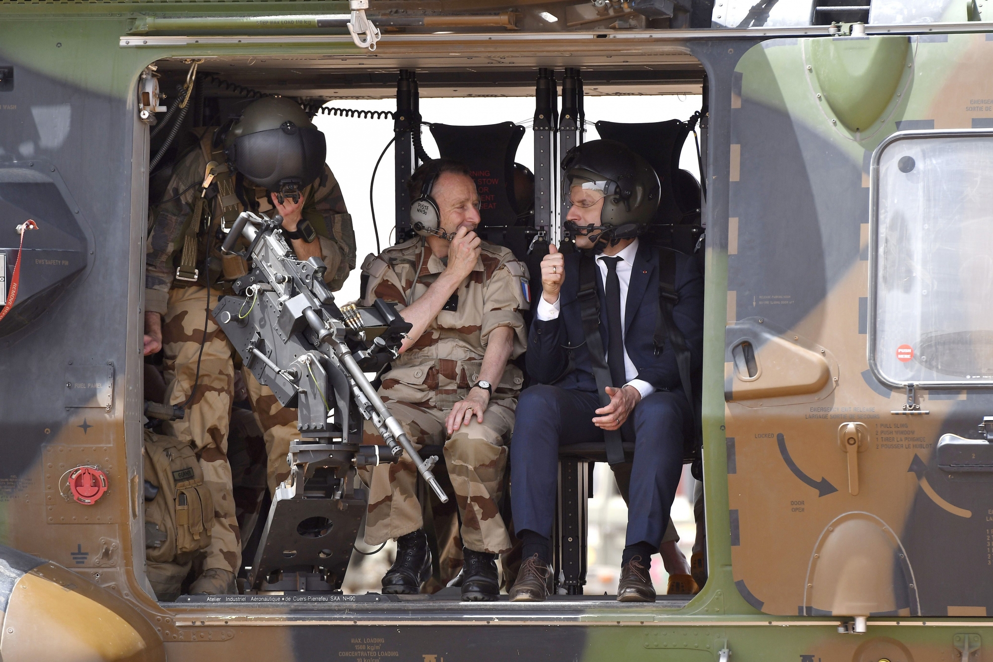 French President Emmanuel Macron, right, takes to Army Chief of Staff, General Pierre de Villiersflies prior to the take off of a military helicopter as they visit the troops of Operation Barkhane, France's largest overseas military operation, in Gao, northern Mali, Friday, May 19, 2017. On his first official trip outside Europe, new French President Emmanuel Macron is highlighting his determination to crush extremism with a visit to French-led military forces combating jihadist groups in West Africa. (Christophe Petit Tesson, Pool via AP) MALI FRANCE PRESIDENT