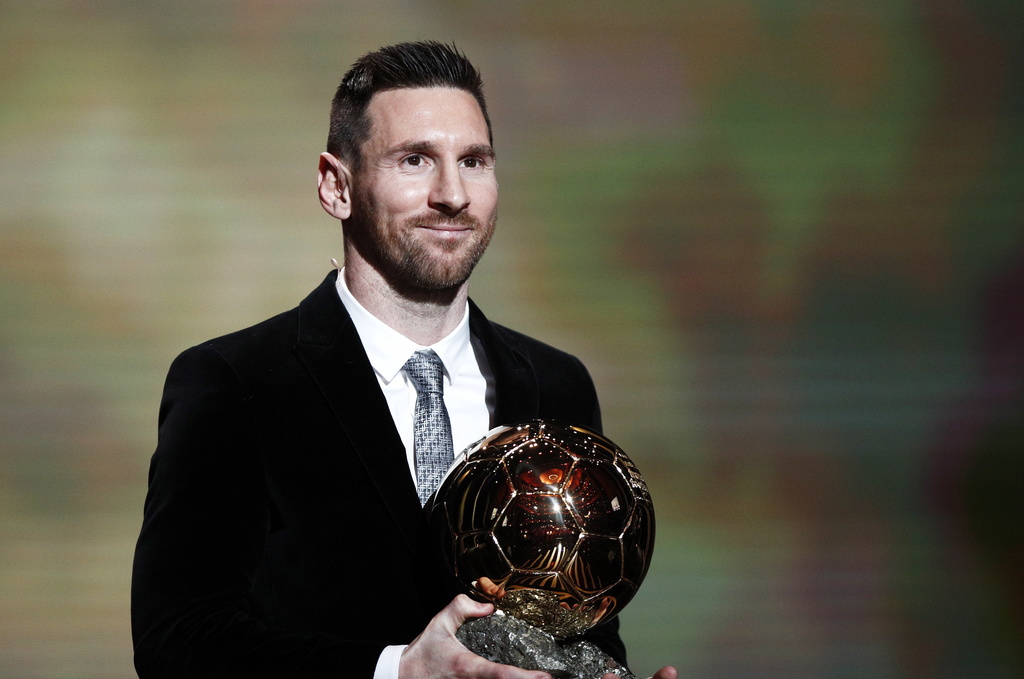 epa08040225 Barcelona forward Lionel Messi wins the Men's 2019 Ballon d'Or at the Ballon d'Or ceremony at Theatre du Chatelet in Paris, France, 02 December 2019. EPA/YOAN VALAT