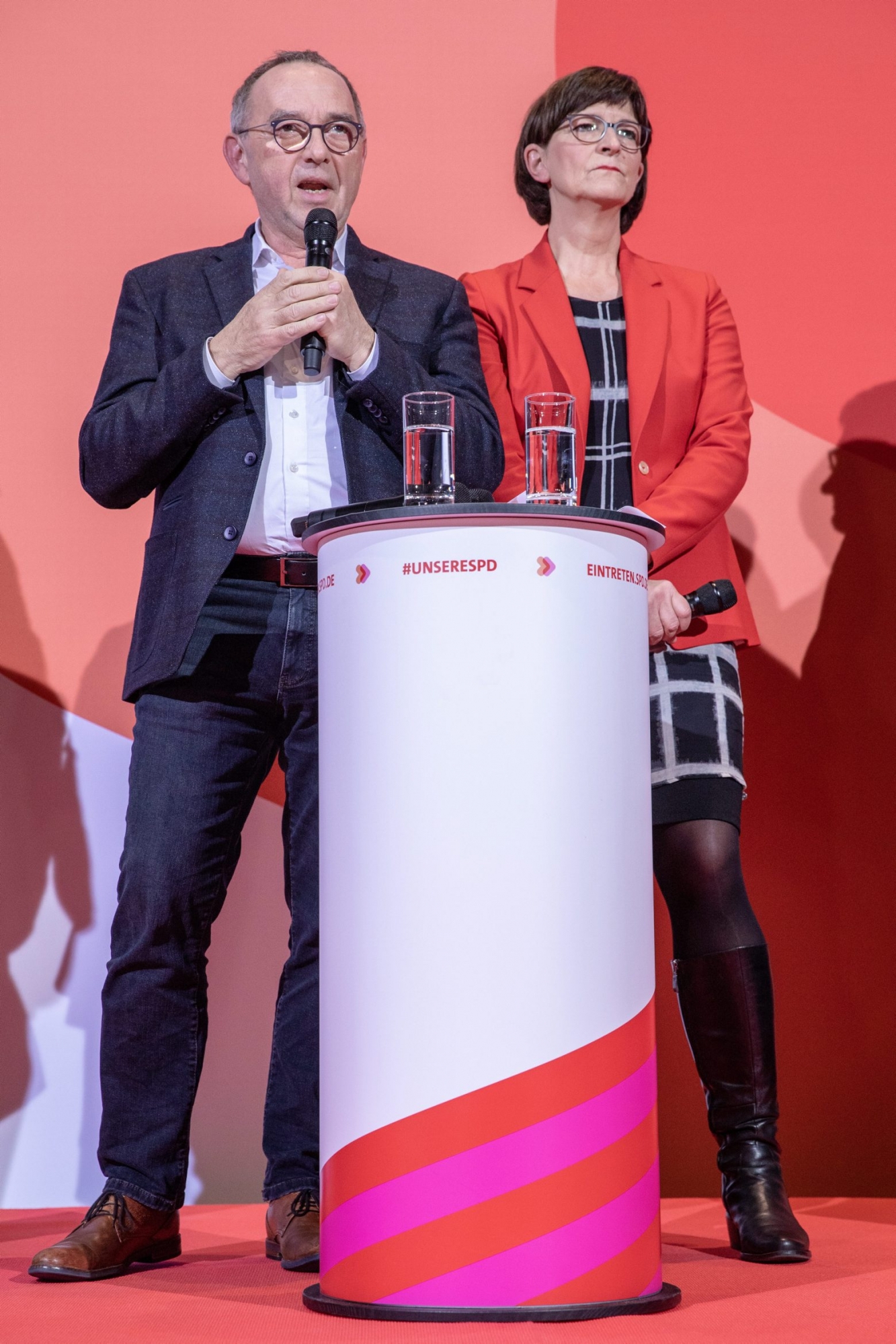 epa08035878 Newly elected co-leaders of the German Social Democratic Party (SPD), Norbert Walter-Borjans (L) and Saskia Esken (R) speak on stage after the announcement of the new SPD leadership vote results at the party's headquarters in Berlin, Germany, 30 November 2019. The SPD on 30 November 2019 announced that Saskia Esken and Norbert Walter-Borjans have won the run-off for party leadership against Klara Geywitz and Olaf Scholz. A party conference in December has to formally approve the new leadership.  EPA/OMER MESSINGER GERMANY PARTIES SPD LEADERSHIP