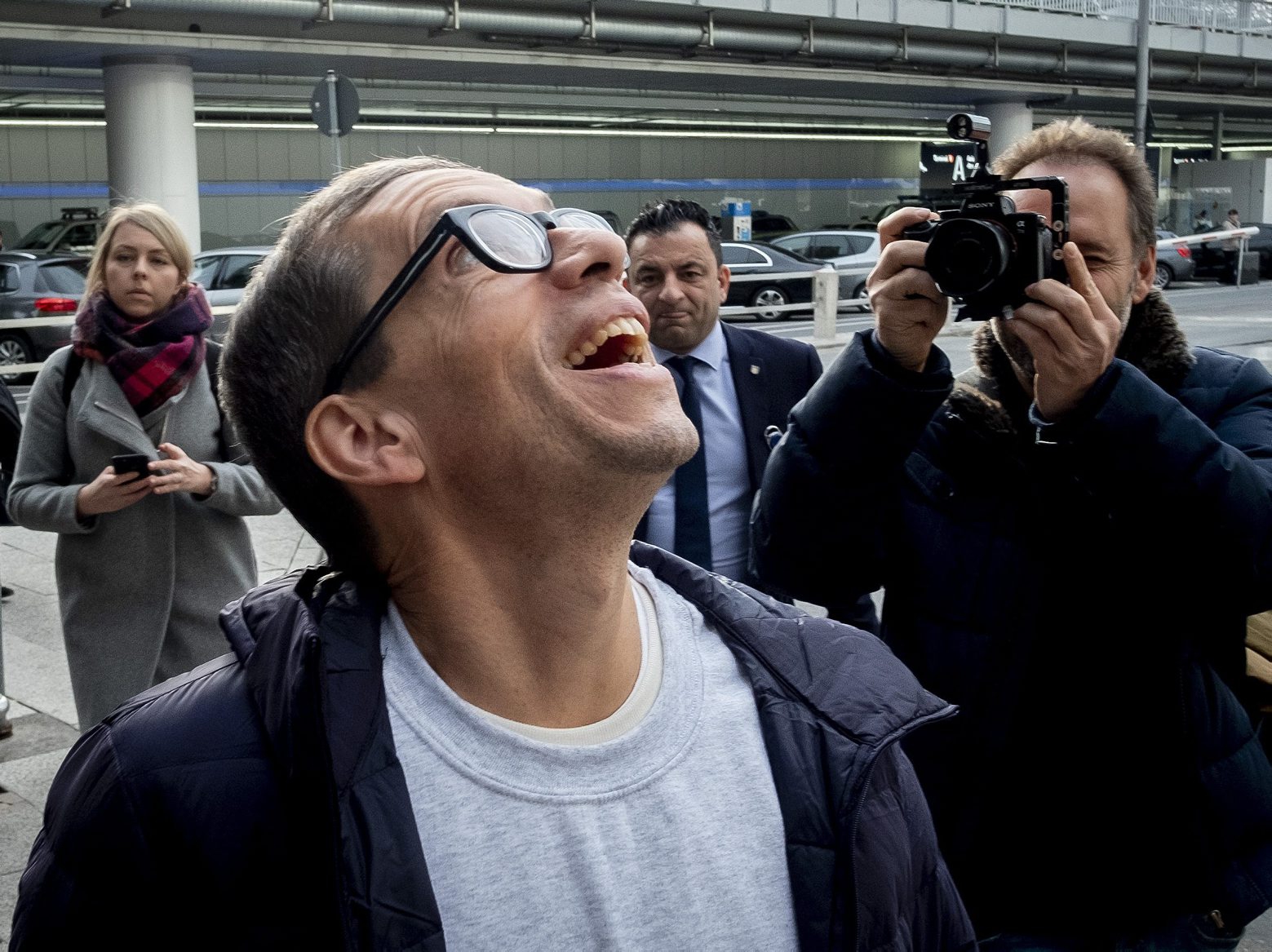 German Jens Soering smiles after his arrival at the Frankfurt Airport in Frankfurt, Germany, Tuesday, Dec. 17, 2019. The son of a German diplomat, who served more than 33 years in prison for a murder in Virginia he has steadfastly maintained he did not commit, arrived in Frankfurt Tuesday after being released on parole. (AP Photo/Michael Probst) APTOPIX Germany US Murder Parole