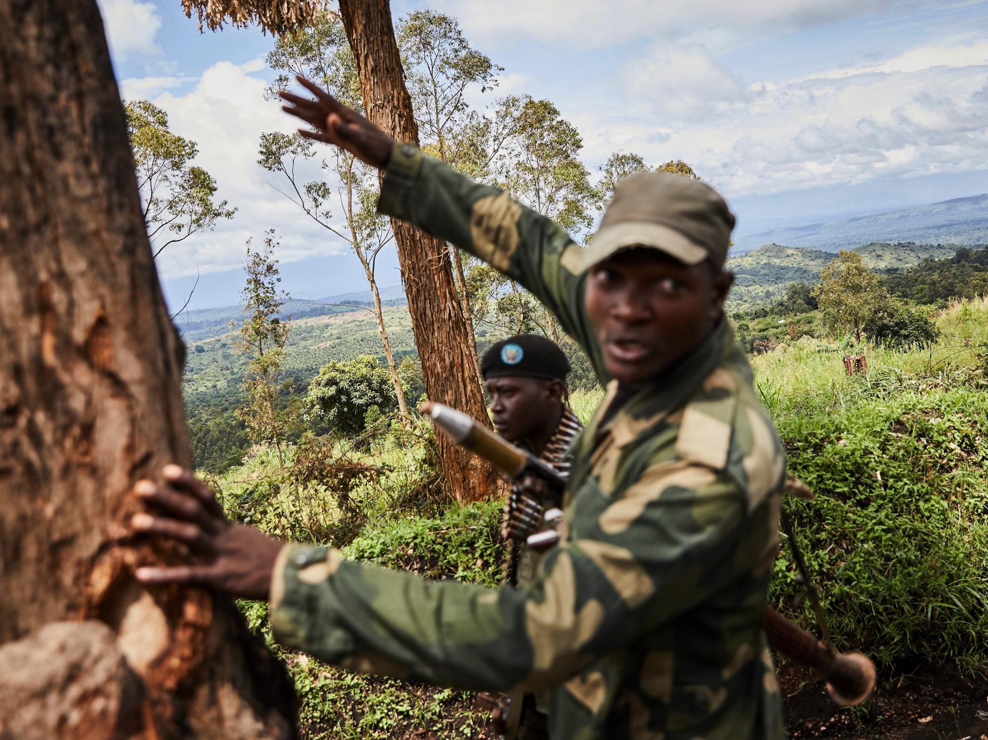 epa07567830 A soldier of the Congolese national army, the Armed Forces of the Democratic Republic of the Congo (FARDC), gestures as he takes up a position that overlooks the so-called 'triangle of death', where the ADF militia group operate, in Beni, North Kivu province, Democratic Republic of the Congo, 11 May 2019 (issued 13 May 2019). Dealing with the Ebola outbreak in Beni has multiple security challenges including attacks from local Mai Mai militia group and the Ugandan-originating Allied Democratic Forces (ADF) rebel group that claimed to be connected to the Islamic State (IS) networks.  EPA/HUGH KINSELLA CUNNINGHAM DR CONGO EBOLA ISLAMIC STATE