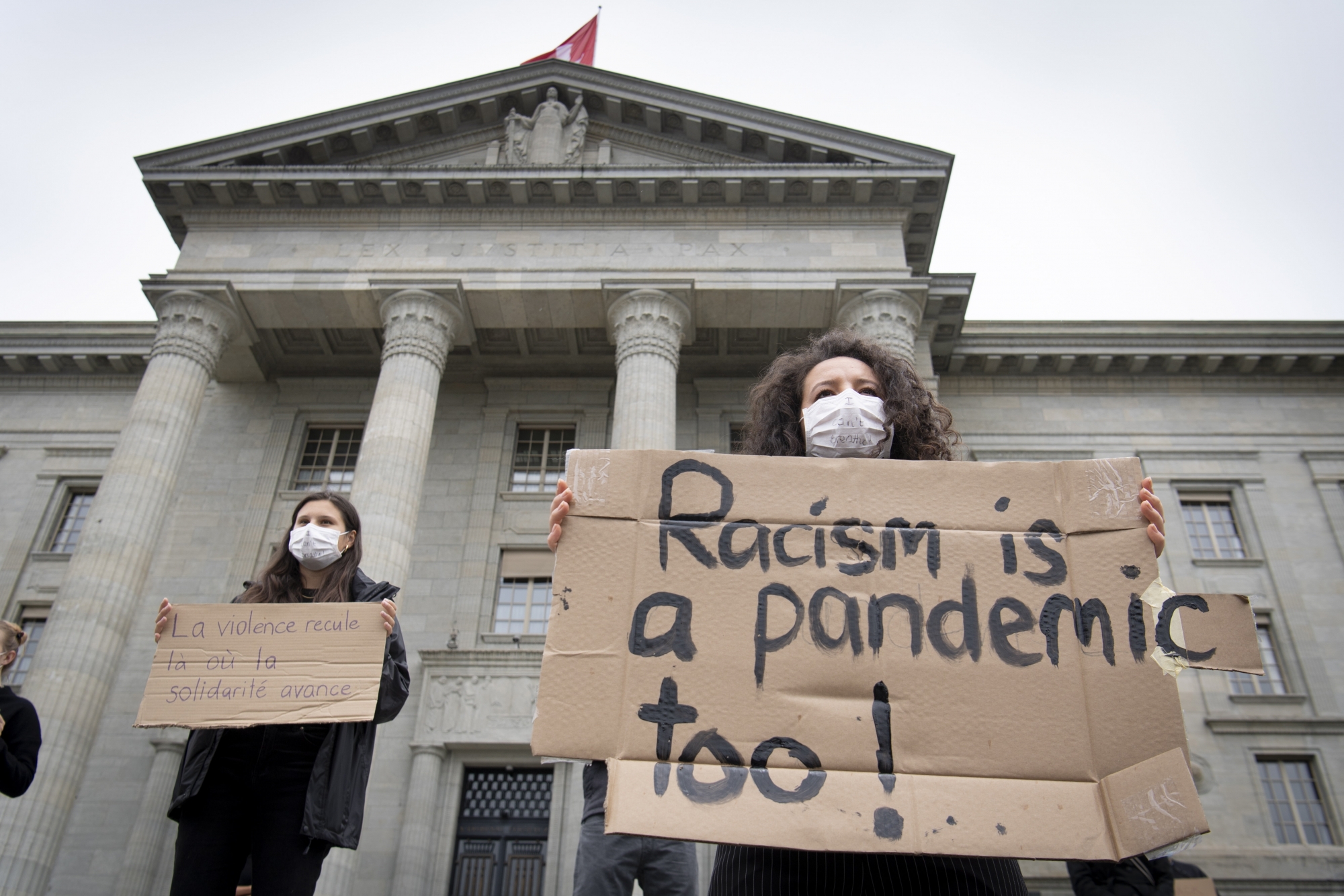 epa08471355 Protesters hold placards in front of the Federal Supreme Court of Switzerland during a Black Lives Matter (BLM) protest, in Lausanne, Switzerland, 07 June 2020. Several thousand people gathered to protest against racism and police violence despite the state of emergency of the coronavirus disease (COVID-19) outbreak and the ban on gatherings of more than 300 people.  EPA/LAURENT GILLIERON
ArcInfo