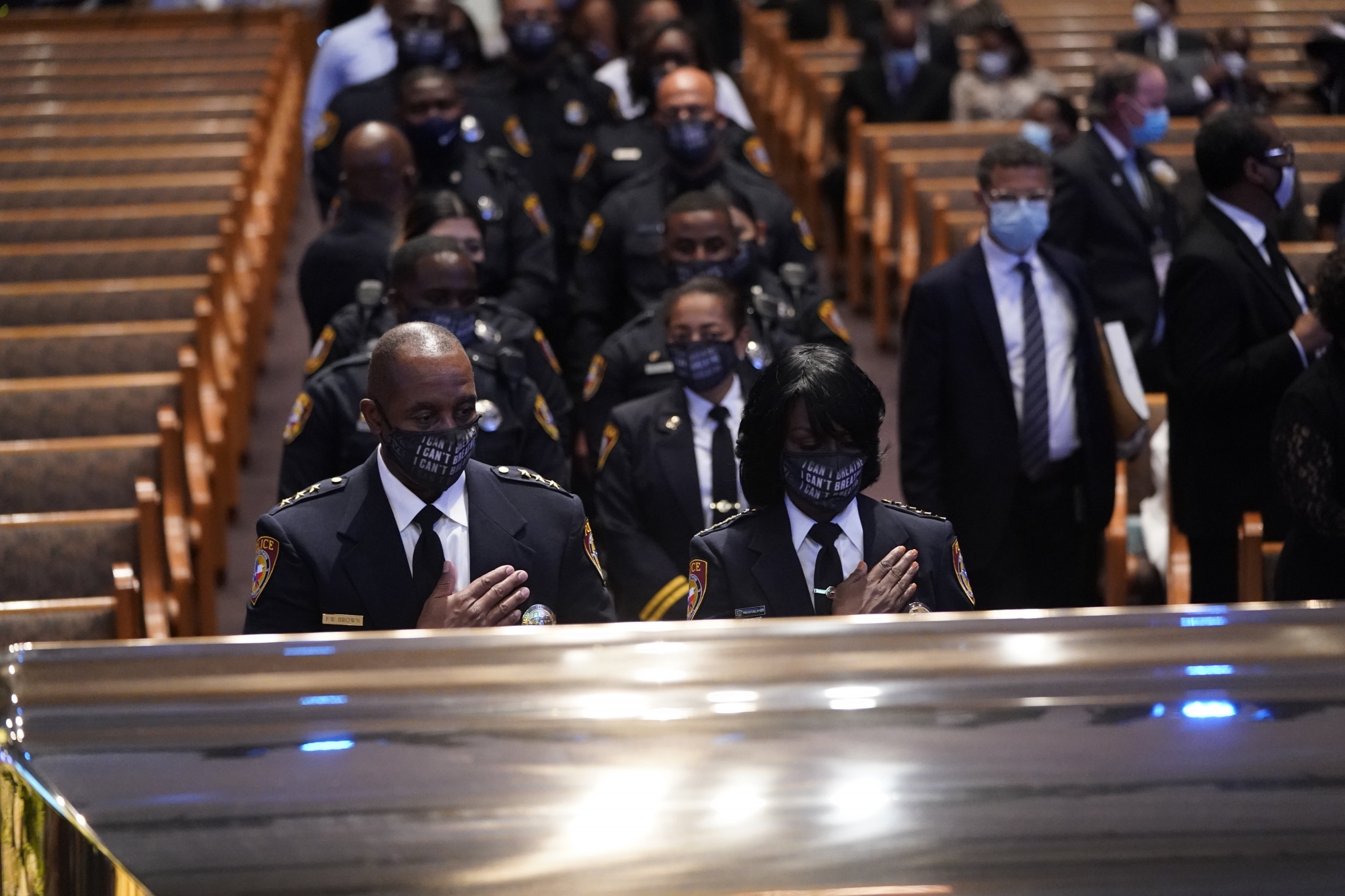 epa08475194 Members of the Texas Southern University police department pause during a funeral service for George Floyd at the Fountain of Praise church, Houston, Texas, USA, 09 June 2020. A bystander's video posted online on 25 May, appeared to show George Floyd, 46, pleading with arresting officers that he couldn't breathe as an officer knelt on his neck. The unarmed Black man later died in police custody and all four officers involved in the arrest have been charged and arrested.  EPA/David J. Phillip / POOL
ArcInfo