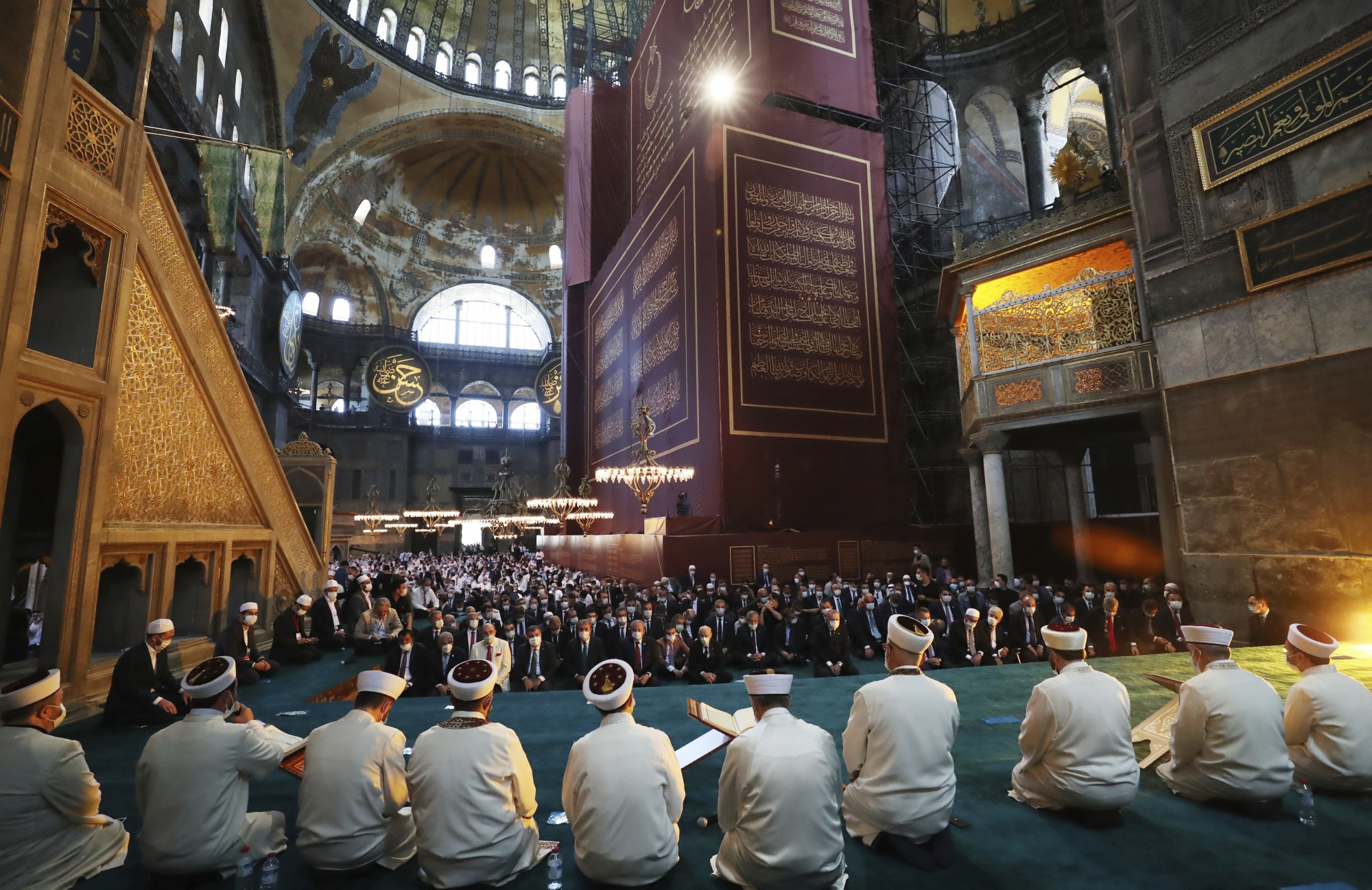 Imams read sermons as Friday as dignitaries including Turkey's President Recep Tayyip Erdogan take part in Friday prayers in Hagia Sophia, at the historic Sultanahmet district of Istanbul, Friday, July 24, 2020. Fulfilling a dream of his Islamic-oriented youth, Erdogan joined hundreds of worshipers for the first Muslim prayers in 86 years inside the Istanbul landmark that served as one of Christendom's most significant cathedrals, a mosque and a museum before its conversion back into a Muslim place of worship. The conversion of the edifice, has led to an international outcry. (Turkish Presidency via AP, Pool) ArcInfo