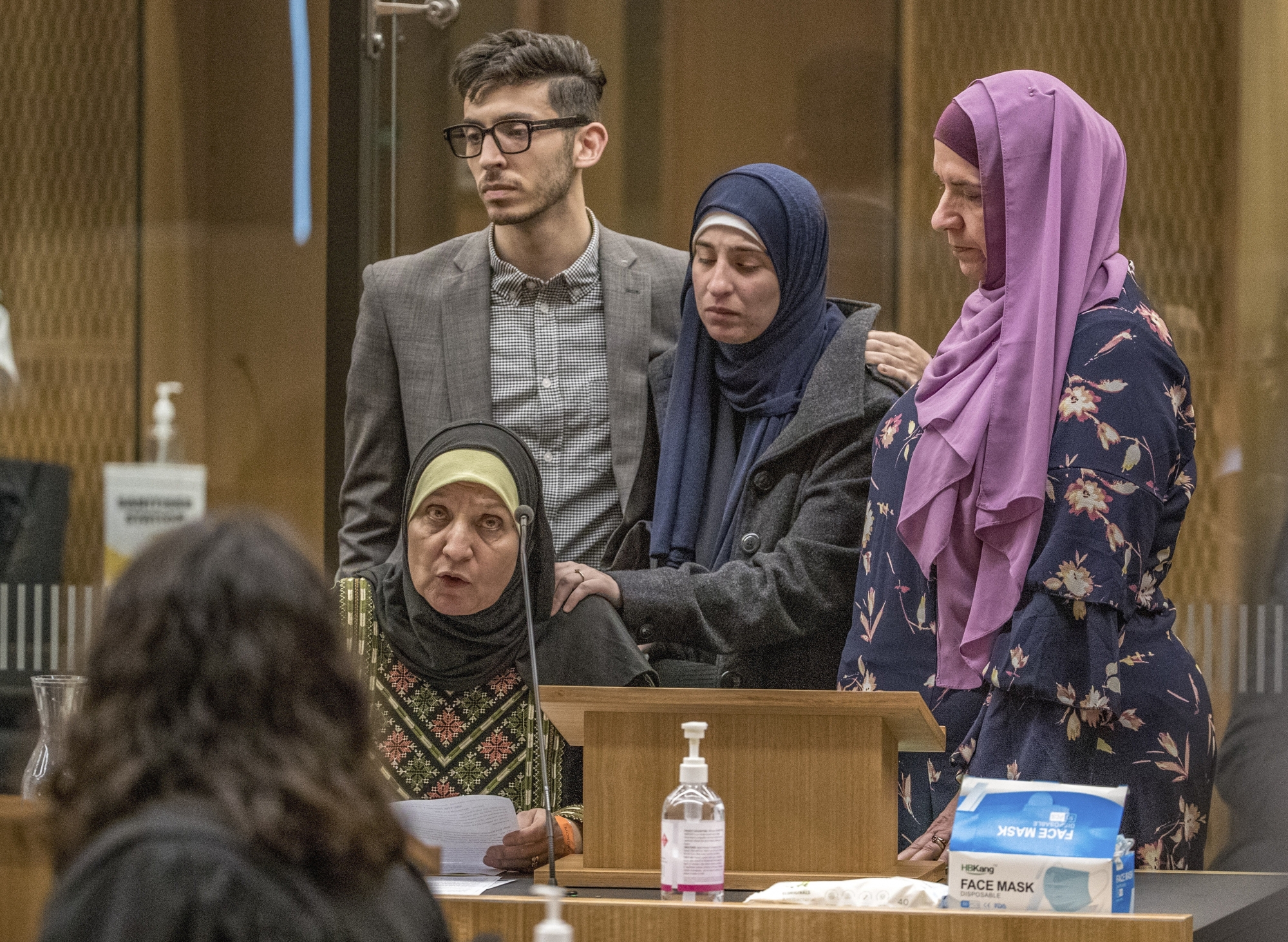 Maysoon Salama, mother of a Mosque shooting victim, with her family, speaks to shooter 29-year-old Australian Brenton Harrison Tarrant at the Christchurch High Court for sentencing after pleading guilty to 51 counts of murder, 40 counts of attempted murder and one count of terrorism in Christchurch, New Zealand, Monday, Aug. 24, 2020. More than 60 survivors and family members will confront the New Zealand mosque gunman this week when he appears in court to be sentenced for his crimes in the worst atrocity in the nation's modern history. (John Kirk-Anderson/Pool Photo via AP) ArcInfo