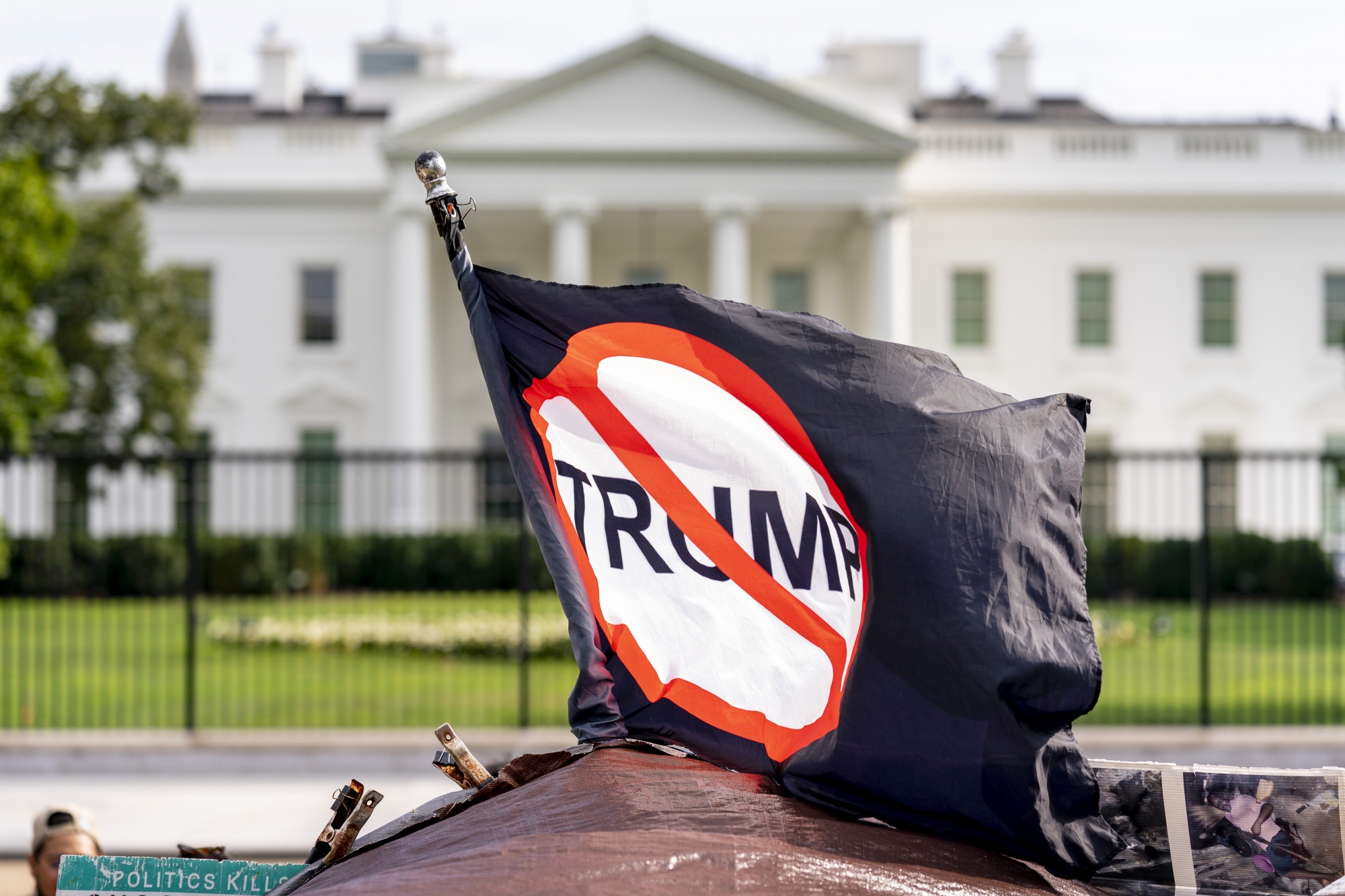 An anti President Donald Trump flag is visible in Lafayette Square outside the White House on the fourth night of the Republican National Convention, Thursday, Aug. 27, 2020, in Washington. (AP Photo/Andrew Harnik) ArcInfo